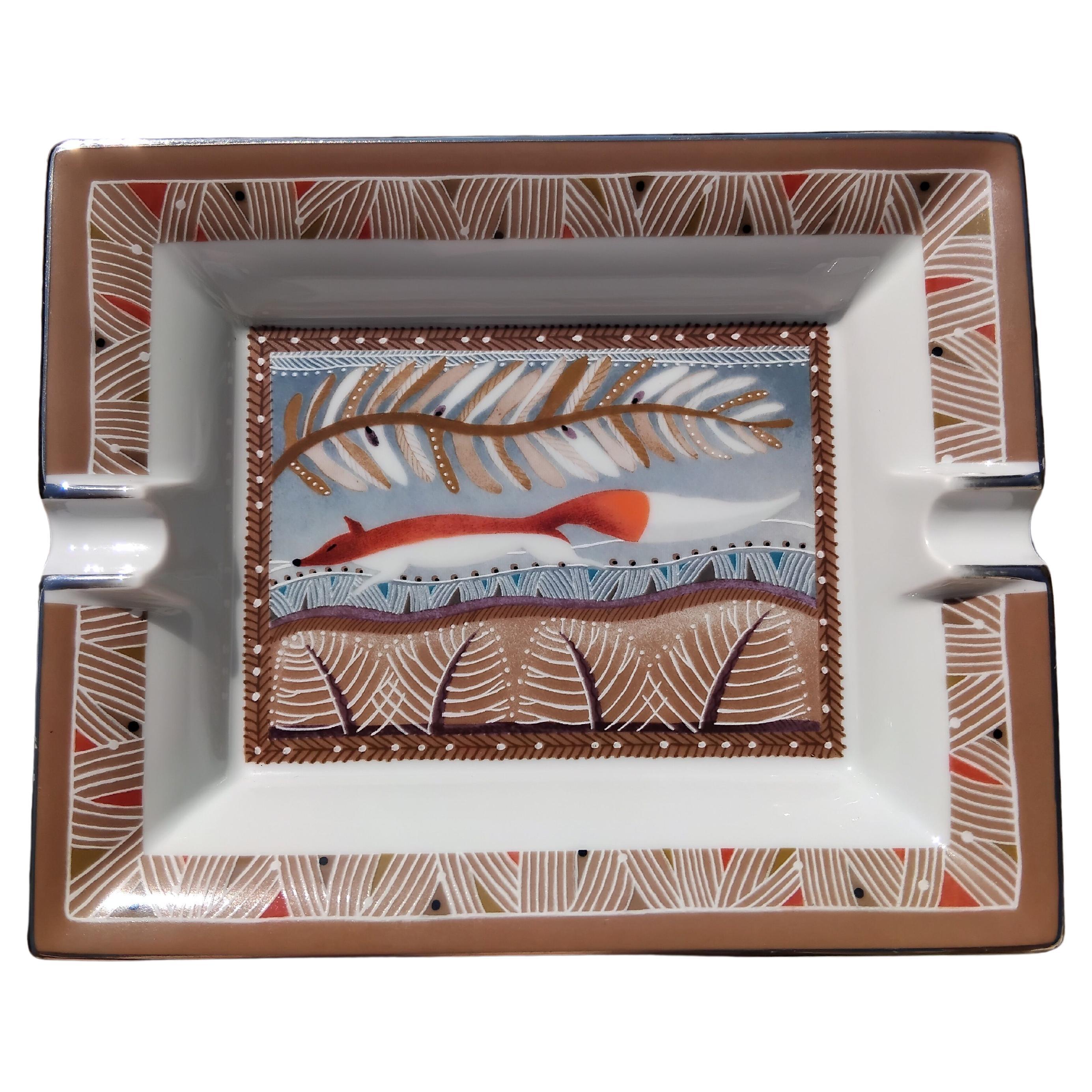 Cute and Rare Authentic Hermès Ashtray

Print: Fox 

The decor reminds me of the scarf entitled 