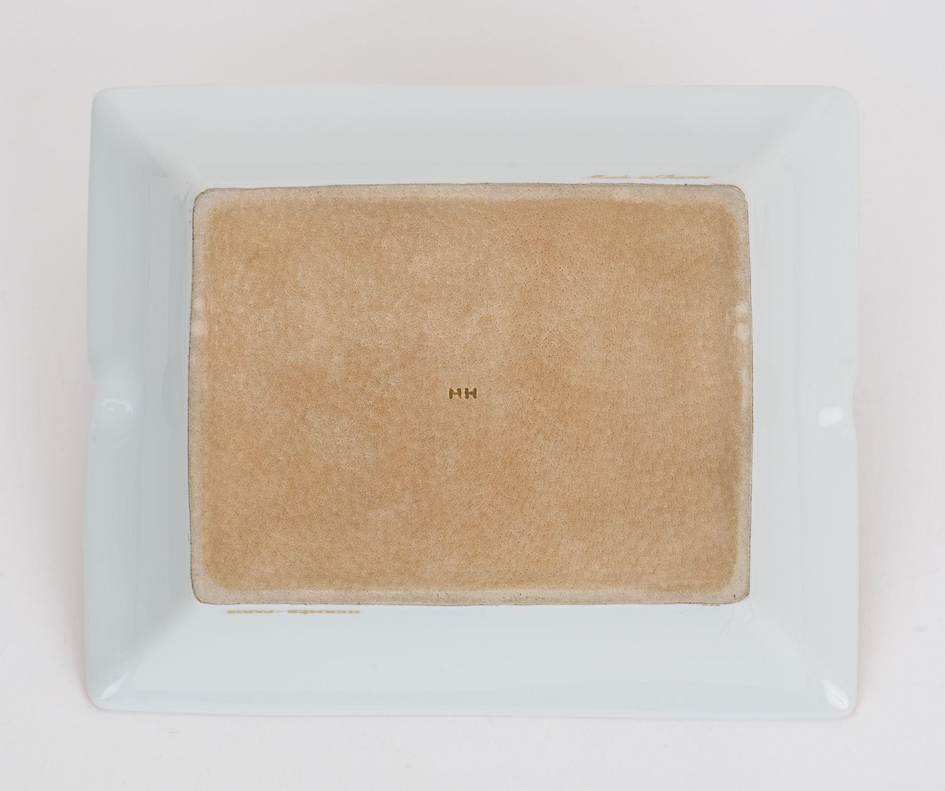 This Hermès ashtray features a beautifully printed french terrier dog that is the perfect accent piece for any room. The tray is protected by velvet goatskin on the base. This piece is wonderful for a desk or gifting.