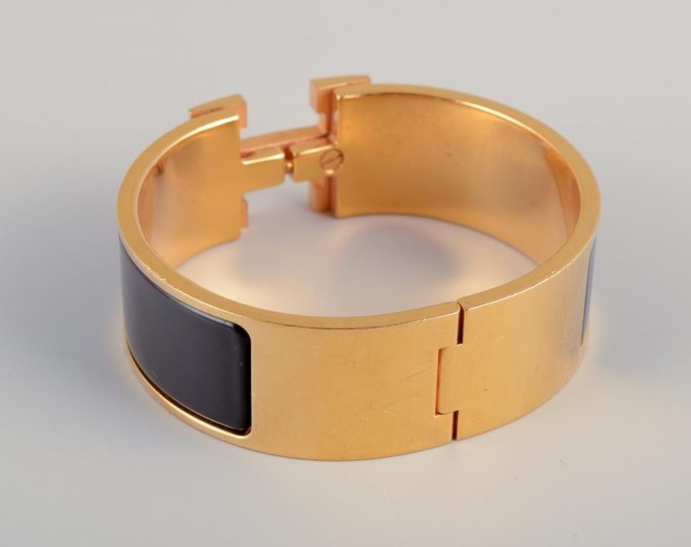Hermes, France. Clic Clac H bracelet. Gold-plated metal and enamel. 2