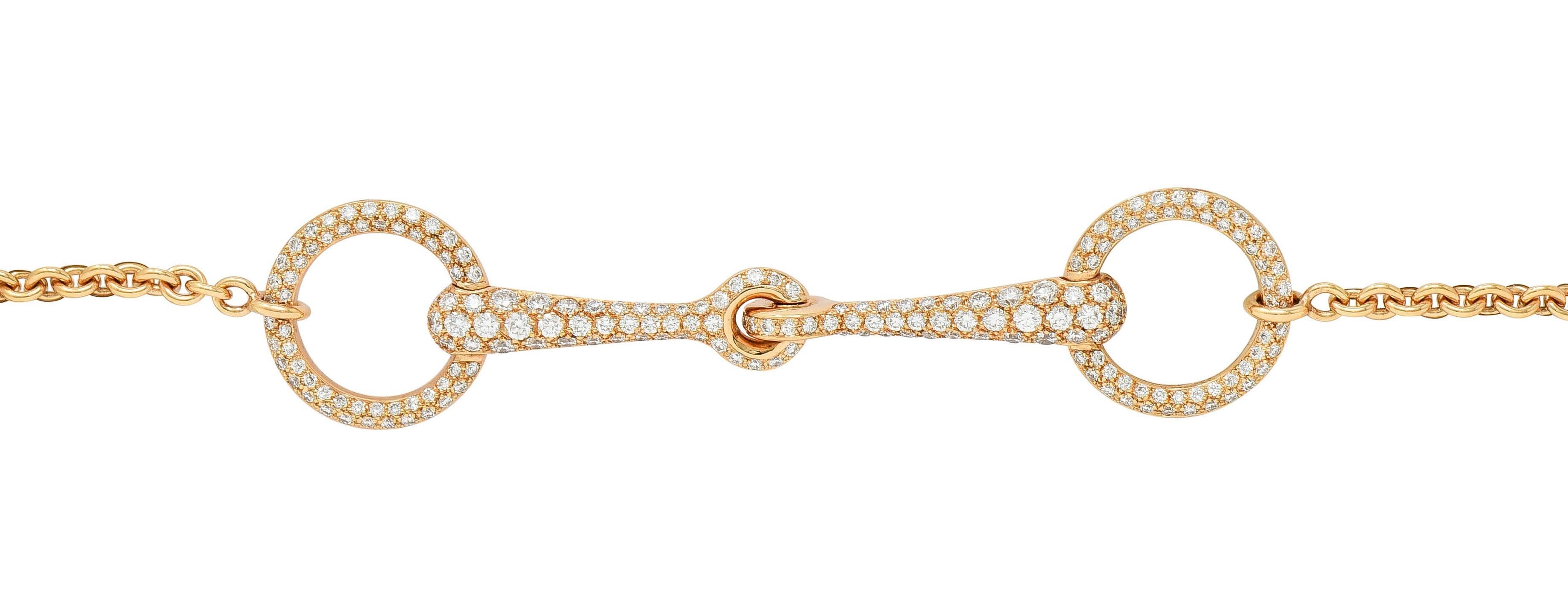 Designed as a cable link chain centering a stylized horse-bit motif 
Pavé set throughout with round brilliant cut diamonds 
With an additional diamond bezel set as drop at clasp
Weighing 0.96 carat total - F color with VS2 clarity
Completed by