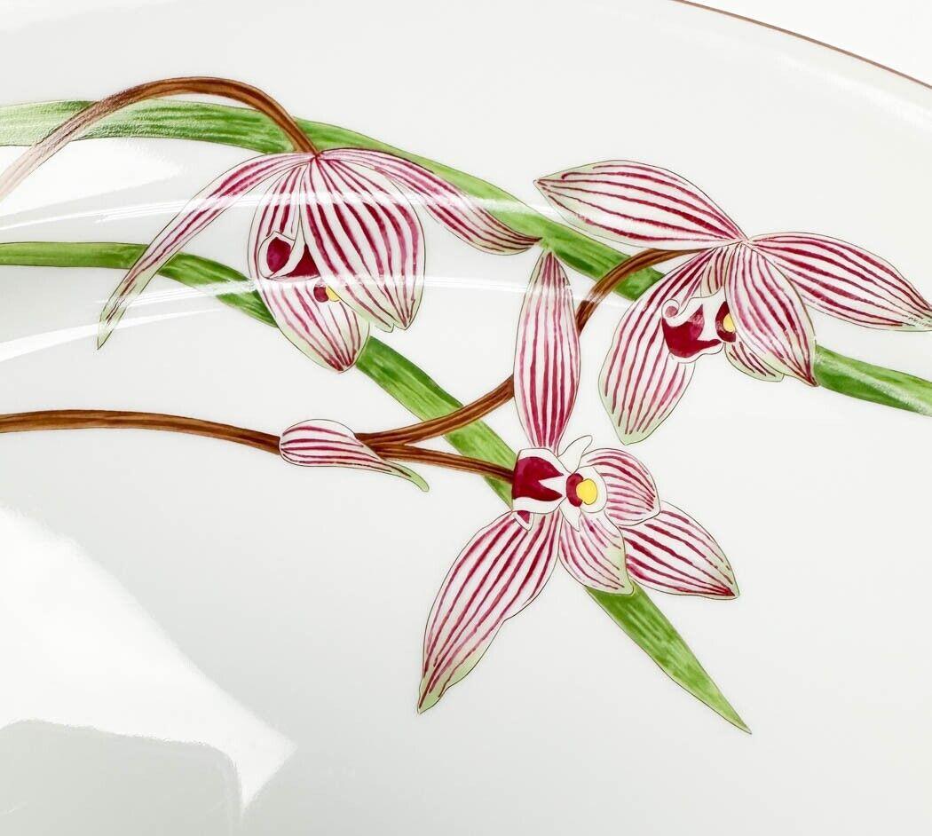 Hermes France Porcelain Serving Tray in Jardin des Orchidees. A white ground with purple and white cymbidium goeringii orchid plants. Underside marked Hermes Paris Jardin des Orchidees cymbidium goeringii.

Additional information:
Country/Region of