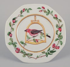 Hermès, France. Two porcelain plates with bird motifs. Late 20th C.