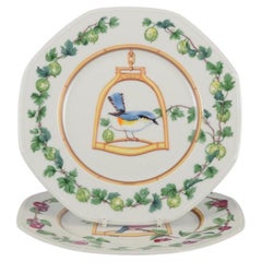 Hermès, France. Two porcelain plates with bird motifs. Late 20th C.
