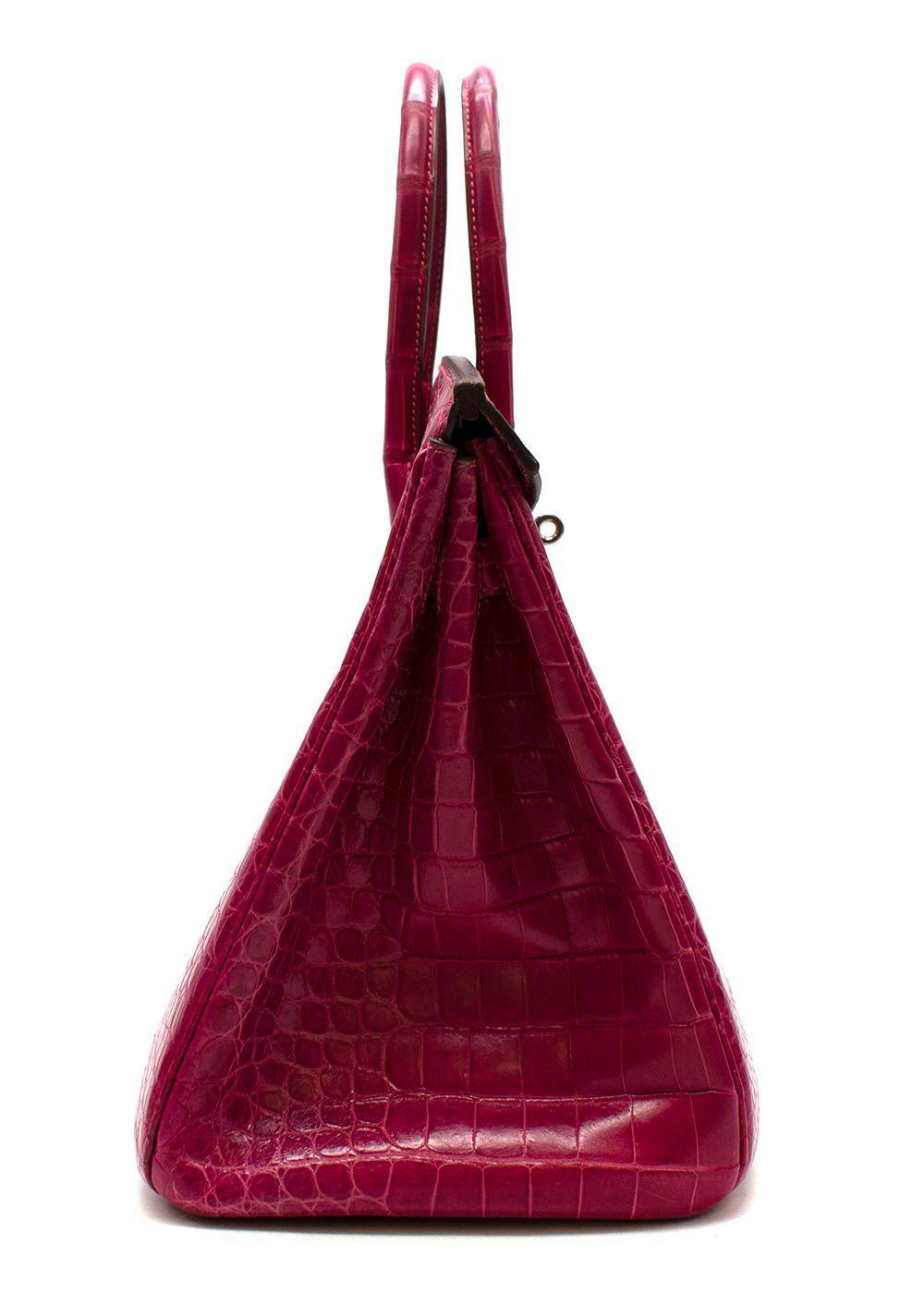 Hermes Fuchsia Shiny Porosus Crocodile Birkin 35 bag with palladium hardware. The bag has been
 to HERMES aftercare and the hardware has been replaced with new. The hardware is all sealed and
 the leather has been cleaned professionally from the