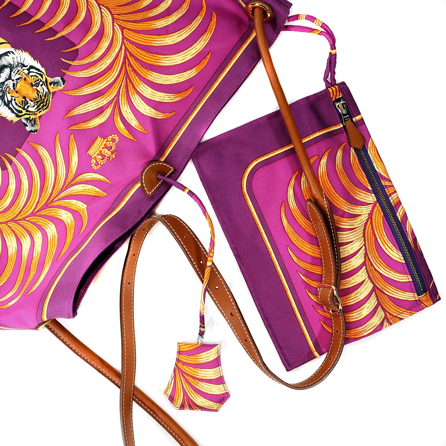 Hermès Silk City Tiger Royal Shoulder Bag- Pristine Condition, appearing never carried
Collectible and rare style in brilliant shades of fuchsia, purple, gold and orange.
Silk body features a royal tiger in repose.  Sturdy reinforced corners in