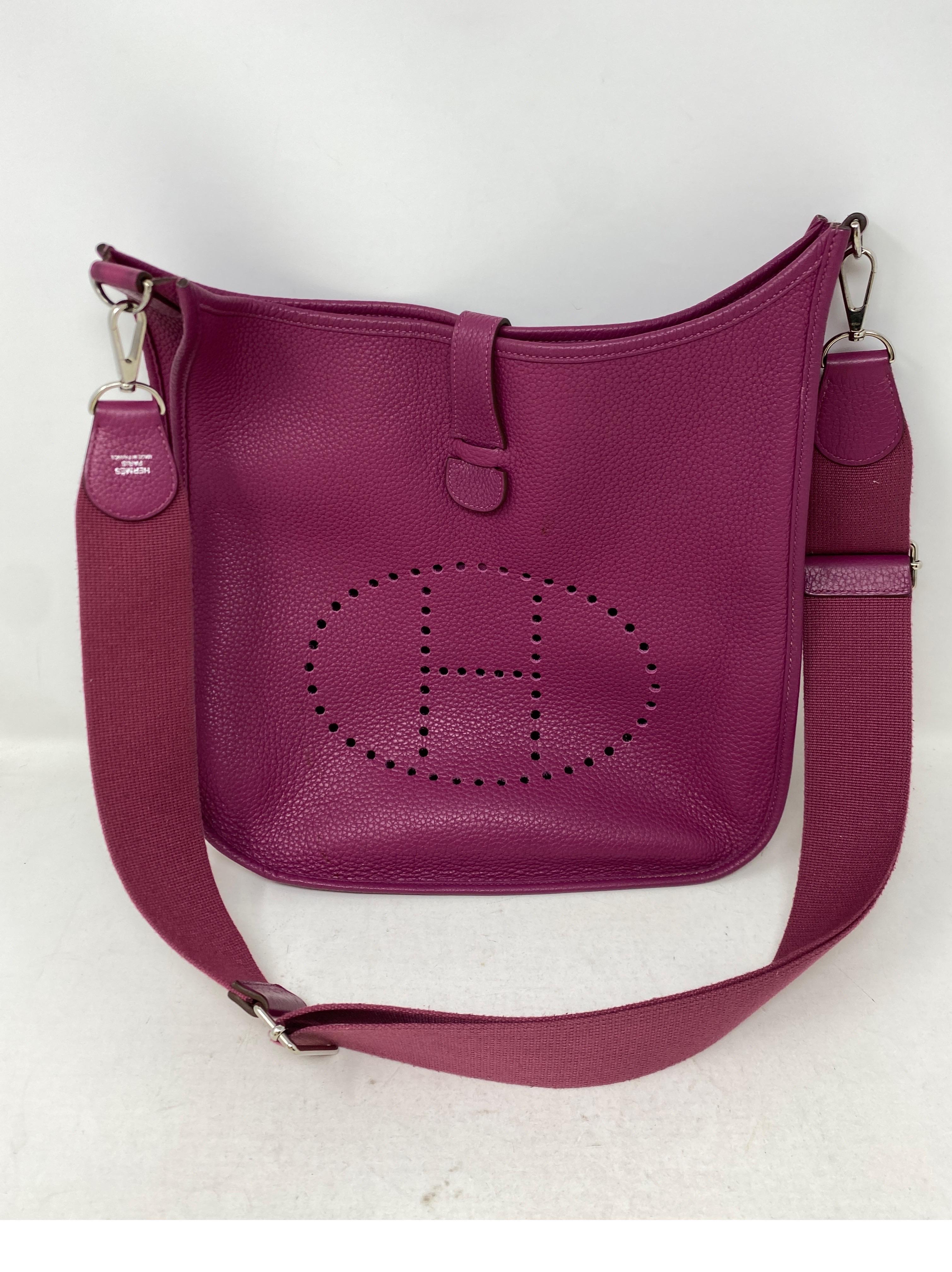 Hermes Fuschia Evelyne GM Bag. Excellent condition. Beautiful purple fuschia color. Palladium hardware. Newer Evelyne bag with adjustable straps. Interior clean. Guaranteed authentic. 