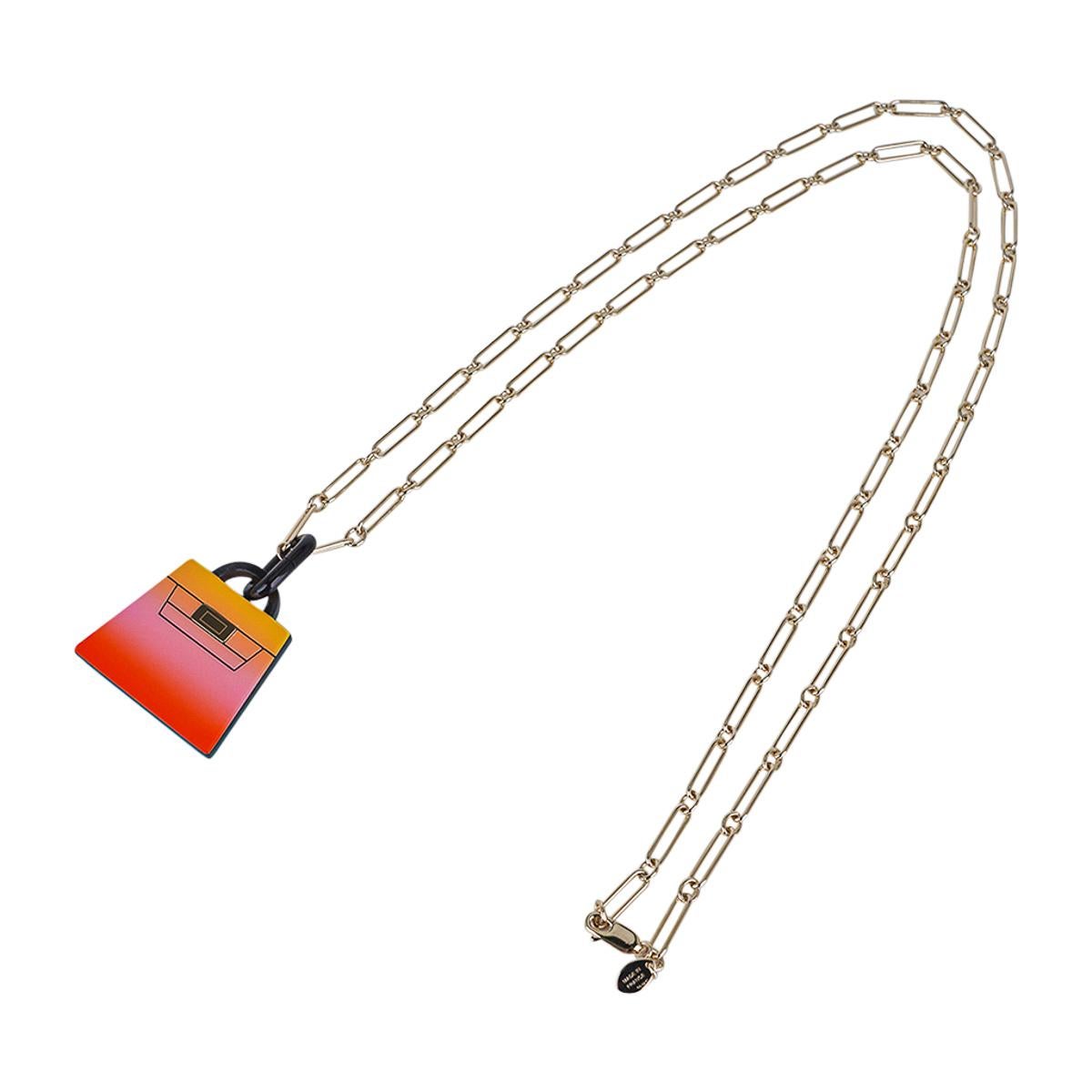 Mightychic offers an Hermes Fusion Kelly Pendant necklace featured in Acidule.
Beautifully lacquered in hues of blue to beach sand.
This special lacquer technique is accentuated with a Permabrass chain link necklace.
Beautiful and unmistakably