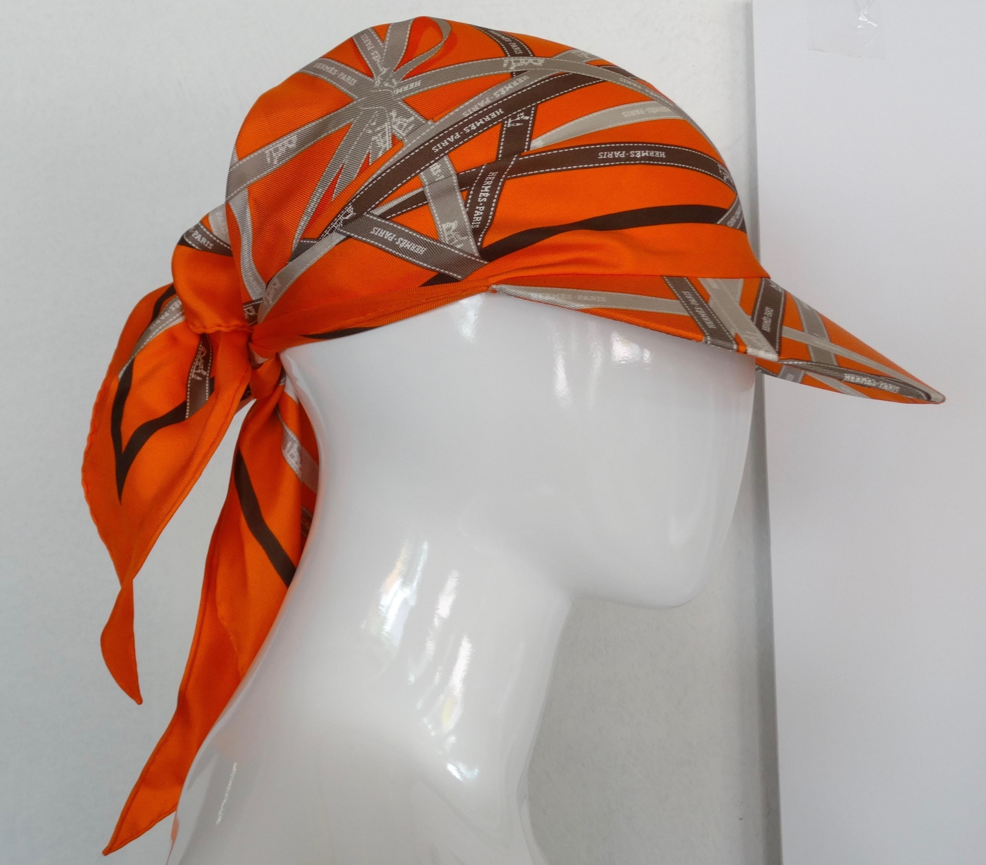 Chic Hermes Gaby Silk Pointu Solaire Wrap Cap!Hermes ribbon in multi-colored geometric print on silk, a firm cap brim and a soft silk scarf top with self tie back closure. You also can tie this head scarf/ cap under the chin. 


Measurements: Brim :