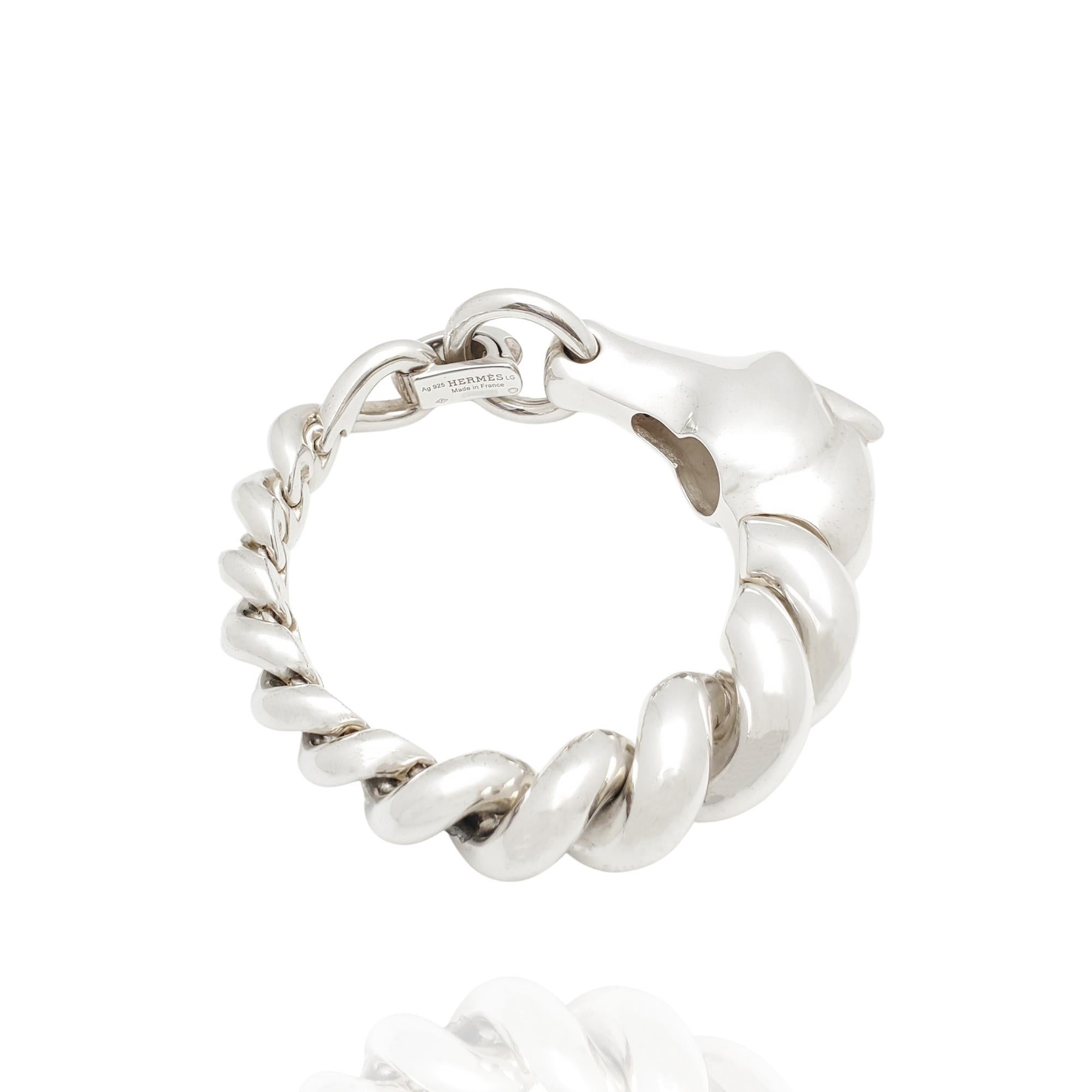 Authentic Hermès Galop bracelet crafted in sterling silver.  The striking profile of a horse is an ode to the iconic brand's origins as an equestrian outfitter.  The twisted links resemble the braid of a horse's mane and the clasp brings it all