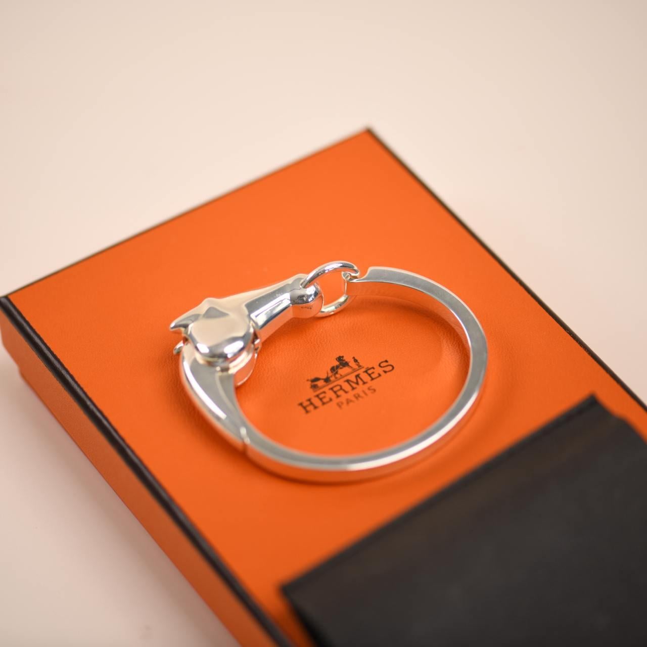 SKU	33301624
Comes With	Box Only
RRP	£1,330 Incl. Taxes
Model	Galop
Serial Number	19G169756
Metal	Sterling Sliver
Weight	Approximately 69.57 g
Width	Approximately 5 mm
Condition	Excellent
Other Info	Internal Circumference: Approximately 16.4cm