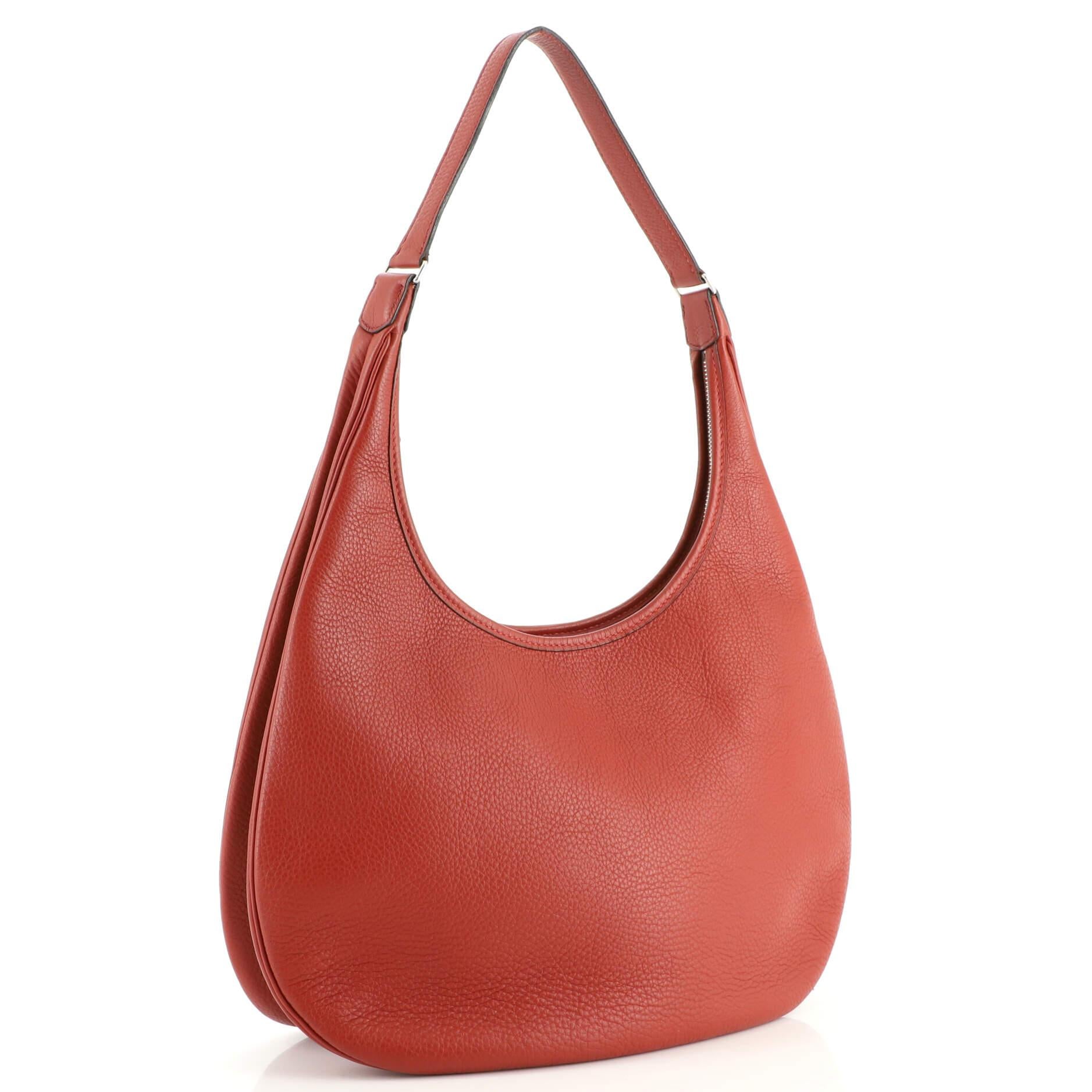 Condition: Very good. Creasing on exterior, minor wear on edges and in interior, cracking and peeling on handle wax edges, scratches on hardware.
Accessories: No Accessories
Measurements: Handle Drop 12