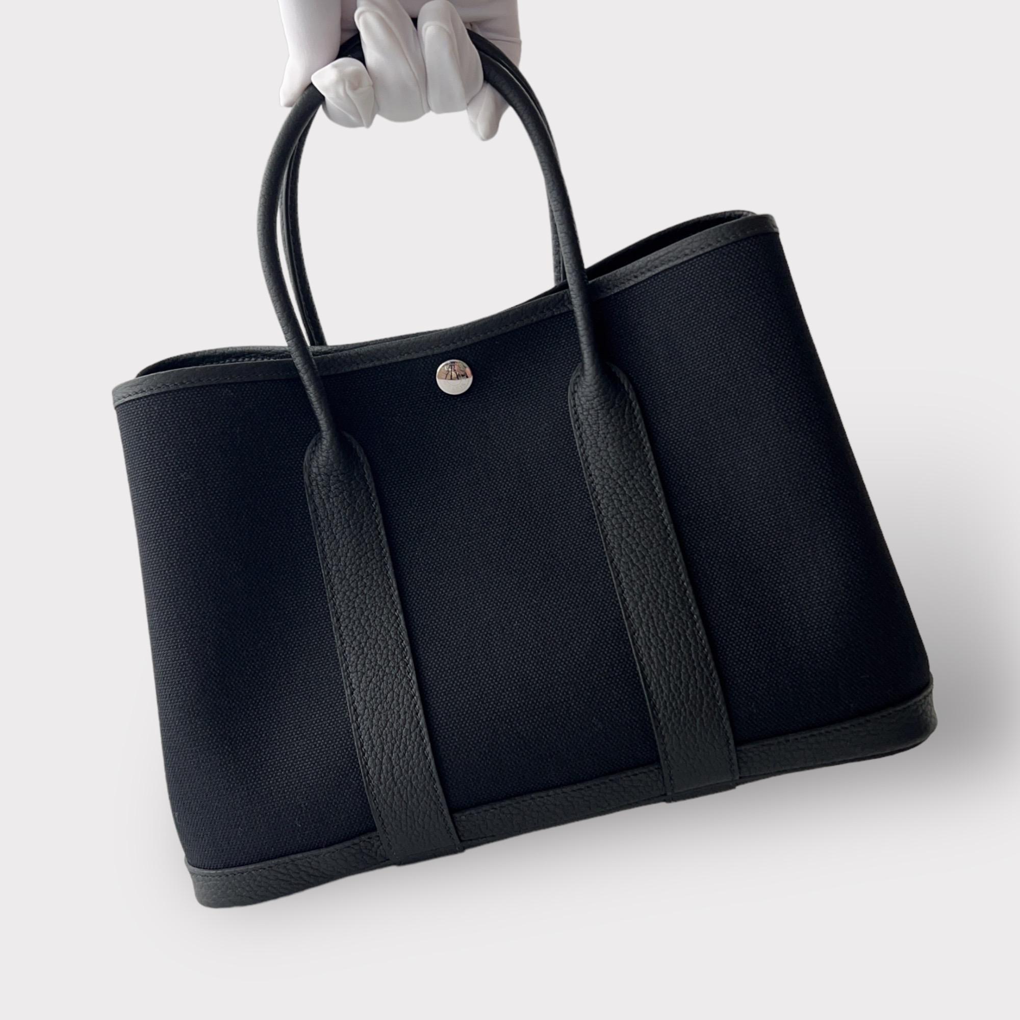 Shop this elegant Hermès Garden Party 30 in the classic colour of Black. This Hermes garden party comes in twill 'H' canvas with leather detailing. The garden party is the perfect everyday tote being very versatile and lightweight to carry. 

Brand: