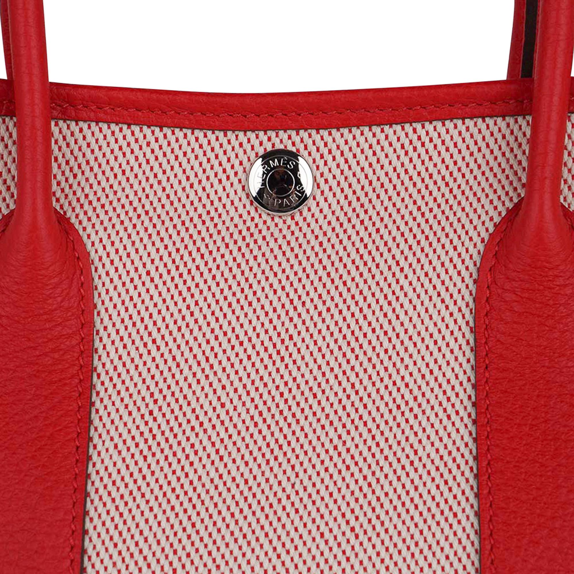 Mightychic offers a guaranteed authentic Hermes Garden Party 30 bag featured in Rouge Grenade with Toile H and Vache Country leather.
Accentuated with palladium Clou de Selle.
Rouge canvas lining and interior pocket.
Comes with signature Hermes box