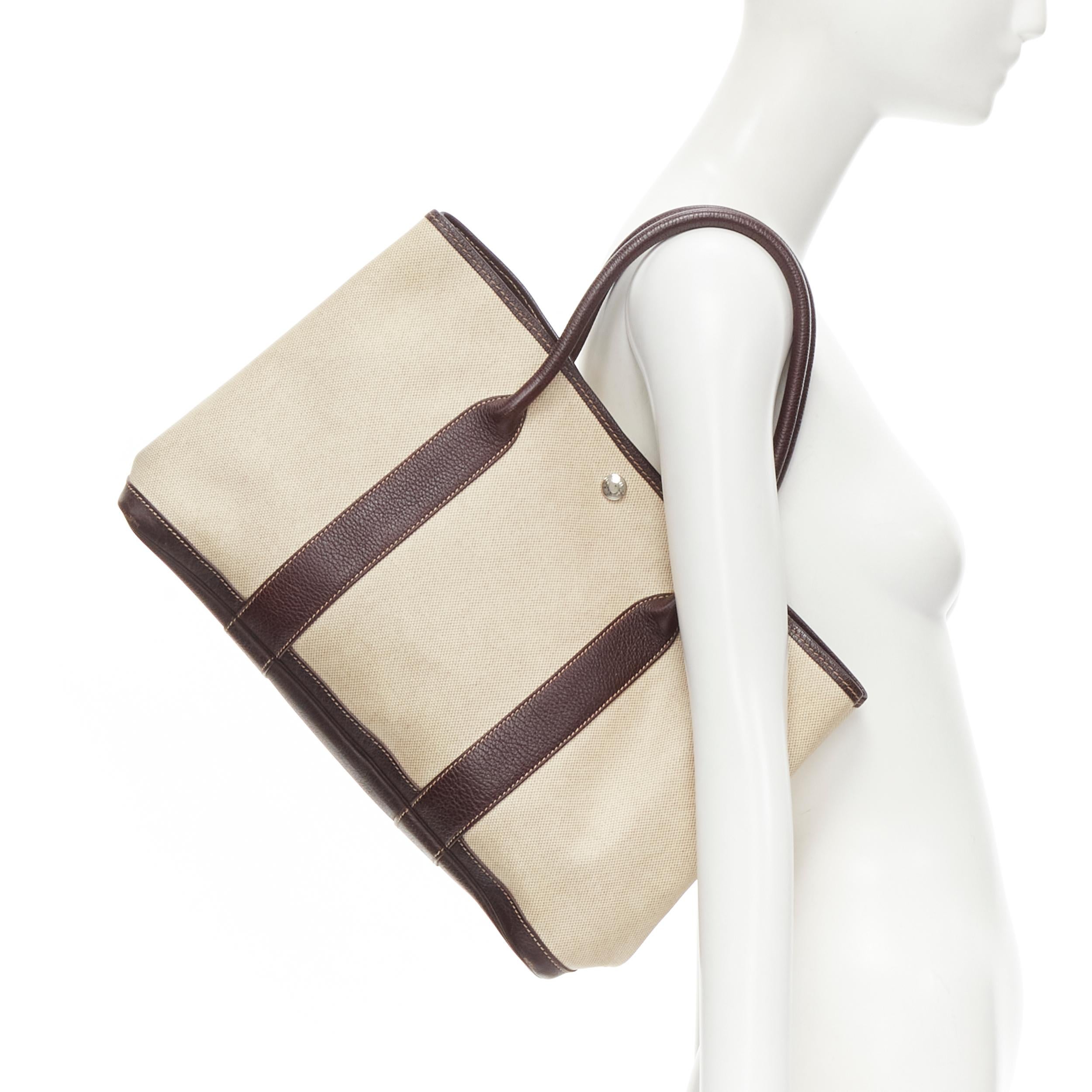 HERMES Garden Party 36 beige coated canvas chocolate brown leather trim tote bag 
Reference: GIYG/A00241 
Brand: Hermes 
Model: Garden Party 36 
Material: Canvas 
Color: Beige 
Pattern: Solid 
Extra Detail: Beige coated canvas. Chocolate leather