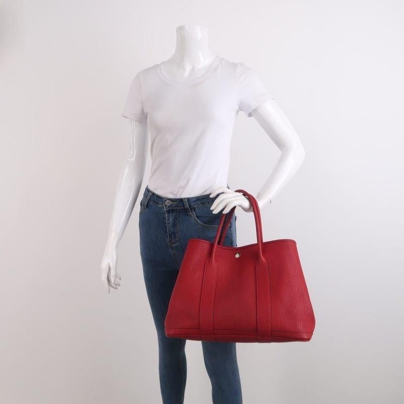 Hermes Garden Party 36 Red Calfskin Leather Handbag 2015
 These are professional photos of the actual bag.
 CONDITION: VERY GOOD 
 This preloved bag is in very good condition with light signs of use throughout. Light scuffs around the bottom, and