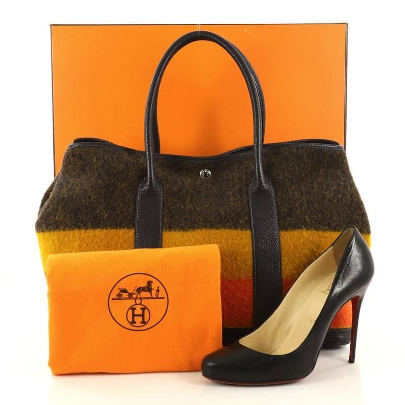 This authentic Hermes Garden Party Tote Rocabar and Leather 36 inspired by the brand's classic Rocabar pattern is a unique piece for any Hermes lovers. Crafted in soft wool in rocabar ptterns with indigo veau negonda leather trimmings, this no-fuss