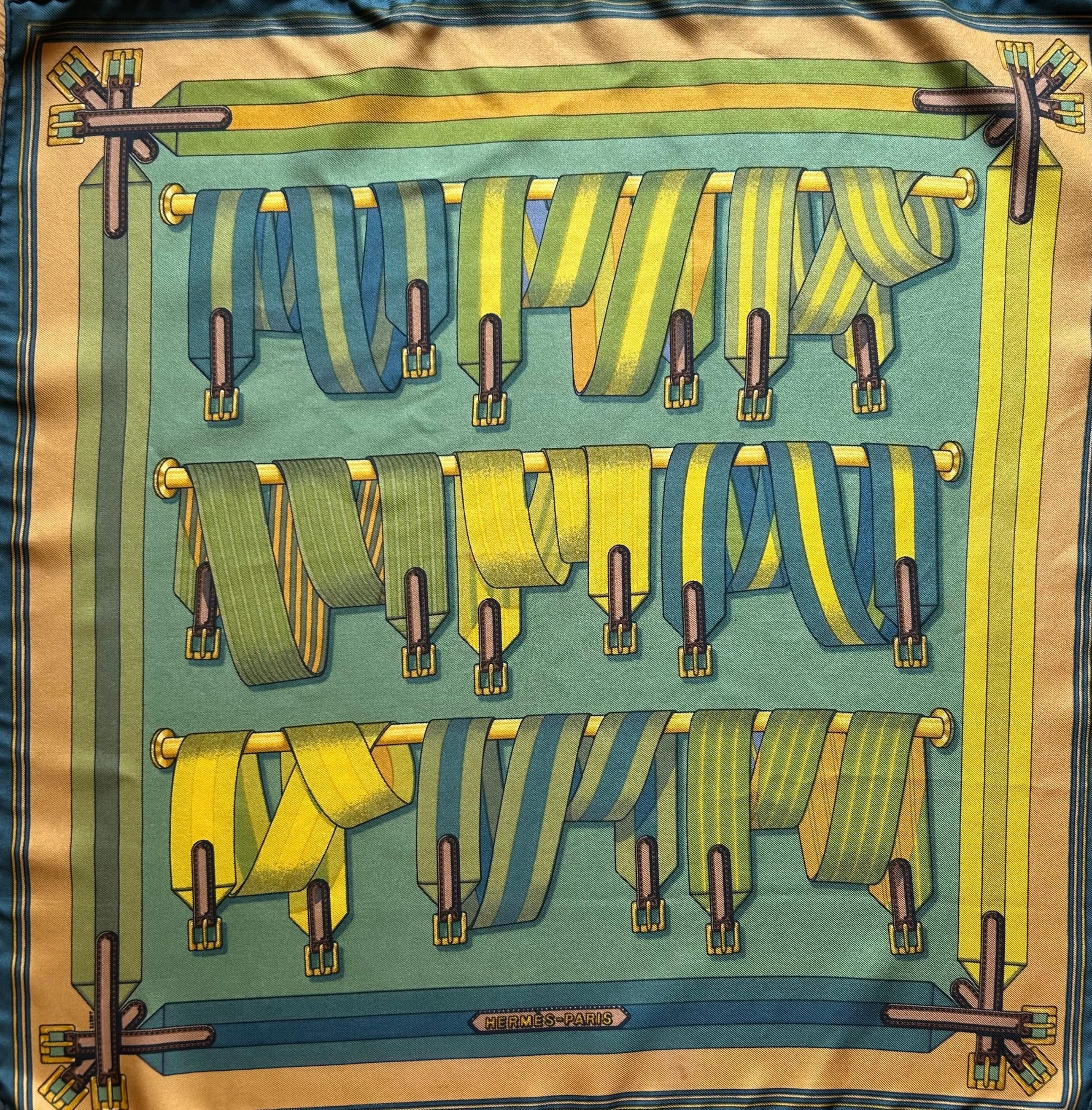 The Hermès Gavroche scarf “Les Sangles” is a vibrant and elegant accessory designed by artist Virginie Jamin. The name “Les Sangles” translates to “The Straps” in English, and the design reflects this theme, showcasing an intricate pattern of