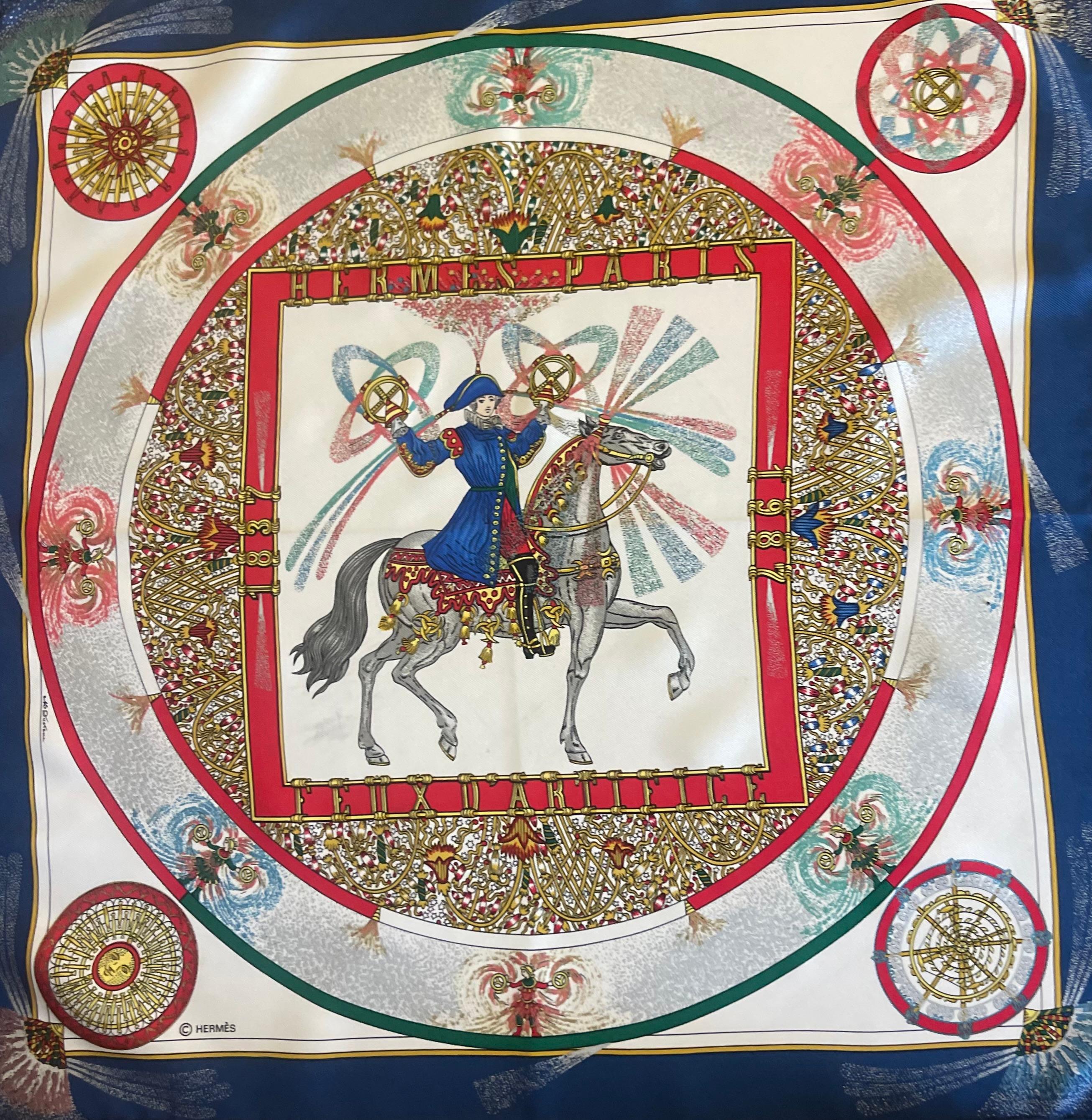 Hermès gavroche Silk scarf “Feus D'Artifice” 1987. 
Please note this item is in good condition with minor wear consistent with age and use. This beautiful scarf was designed in 1987 by Michel Duchenne and then reissued in 1989 as a gavroche due to