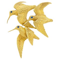 HERMÈS GEORGES LENFANT Broche clip oiseaux vintage en or jaune 18 carats et saphirs 