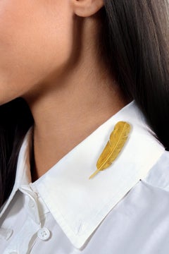 Hermés Georges L'Enfant francese degli anni '60 in oro giallo 18 carati Spilla con piume vintage