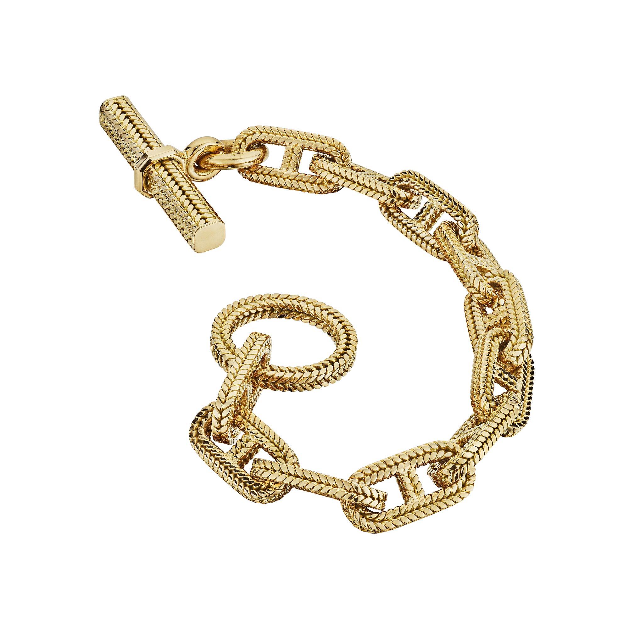 Big, bold, and chunky this rare large size Hermes Georges L'Enfant Paris 'chaine d'ancre' vintage toggle link bracelet is the statement piece you have been searching for.  With ten links weighing 89.2 grams, this woven herringbone 18 karat yellow