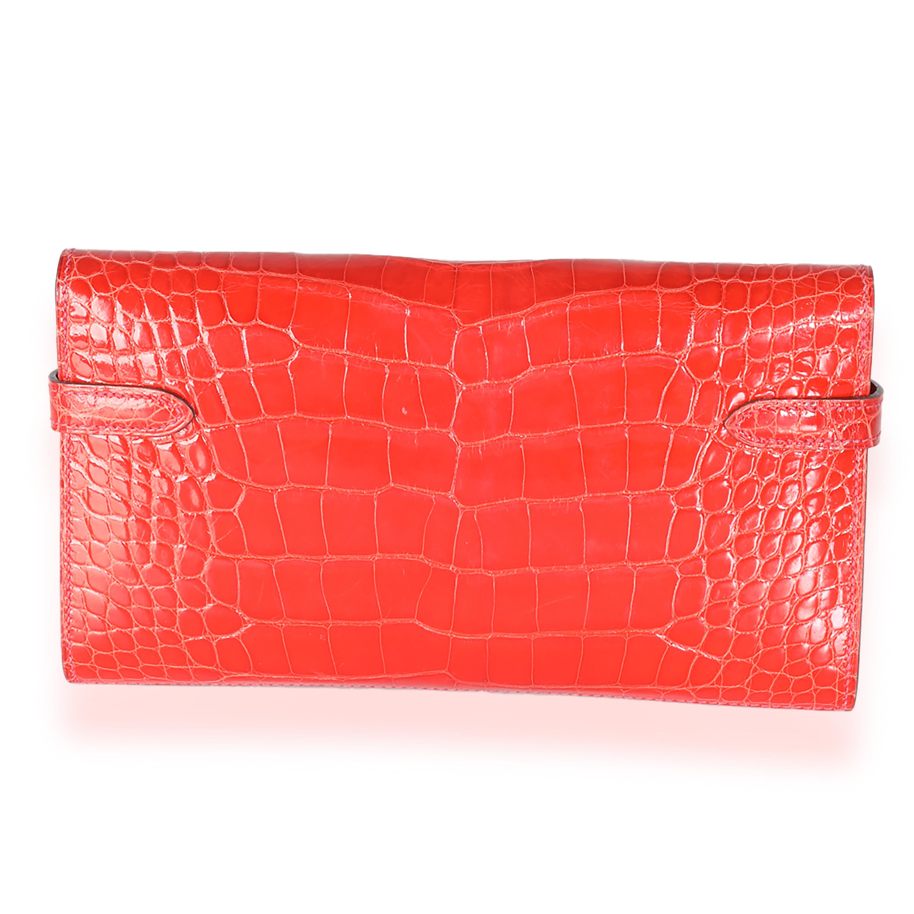 Listing Title: Hermès Geranium Alligator Mississippiensis Kelly Wallet GHW
SKU: 140265
Condition: Pre-owned 
Condition Description: Officially renamed in 1977, the Kelly tote bag from Hermès was originally called the Sac à Dépêches (which translates