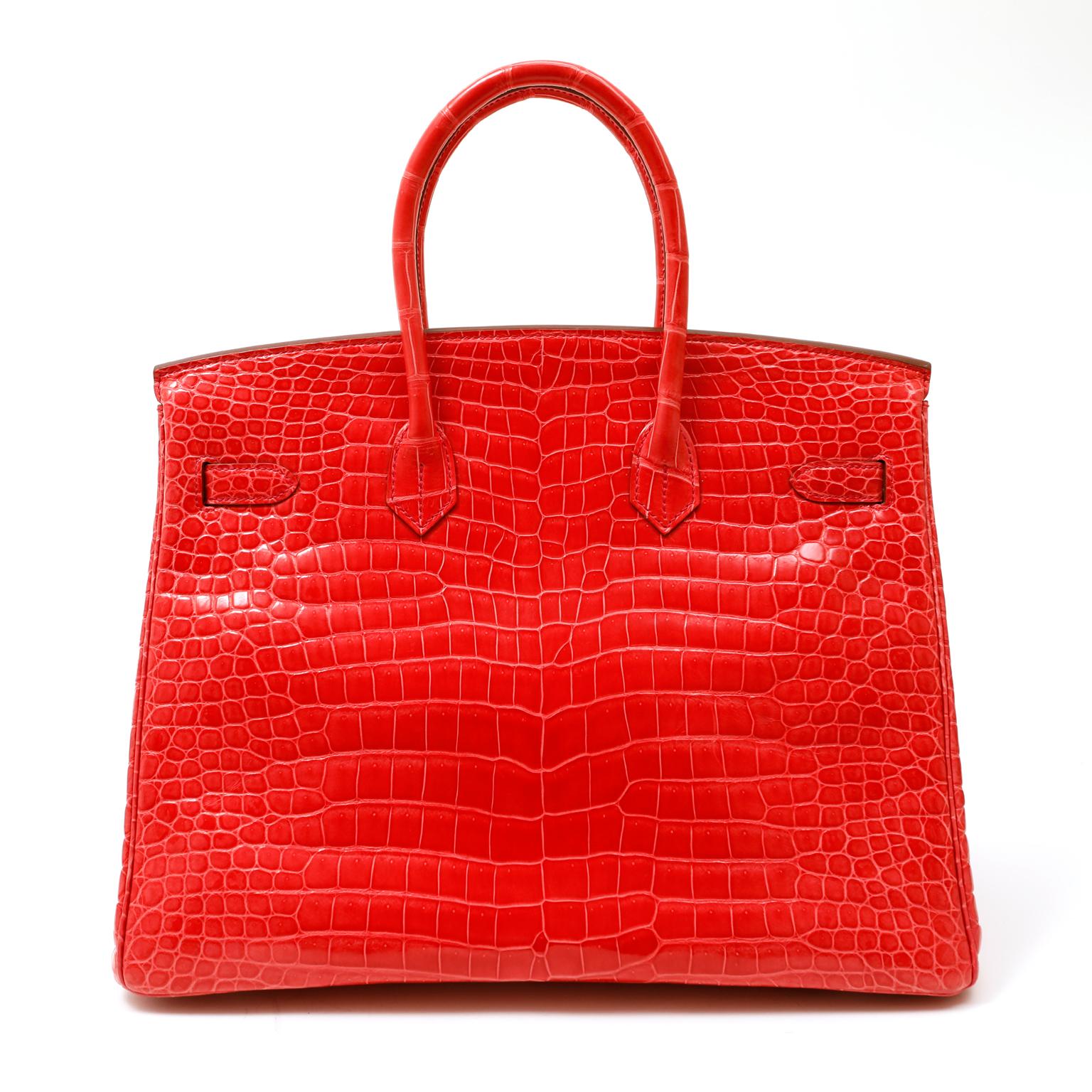 This authentic Hermès Geranium Red Porosus Crocodile 35cm Birkin is in excellent condition.  Incredibly rare and specially ordered, this exotic Birkin is truly stunning in vibrant red with sophisticated Palladium hardware.
Hermès bags are considered