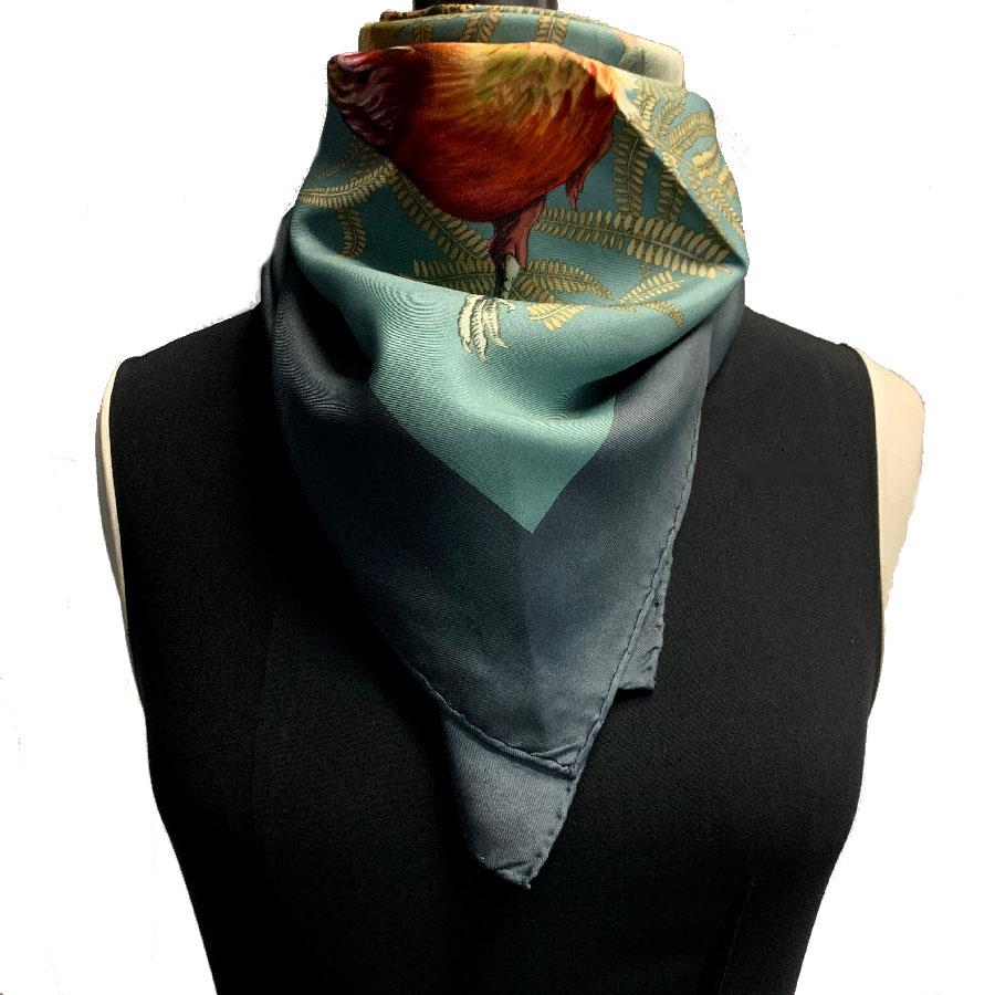 HERMES vintage scarf, Gibier model, in green-gray silk on a multicolored background.

Rare and sought after, this Hermes Gibier scarf is in gray silk. The pattern represents the hunting trophy: game such as pheasant, rabbit, duck. It is designed by