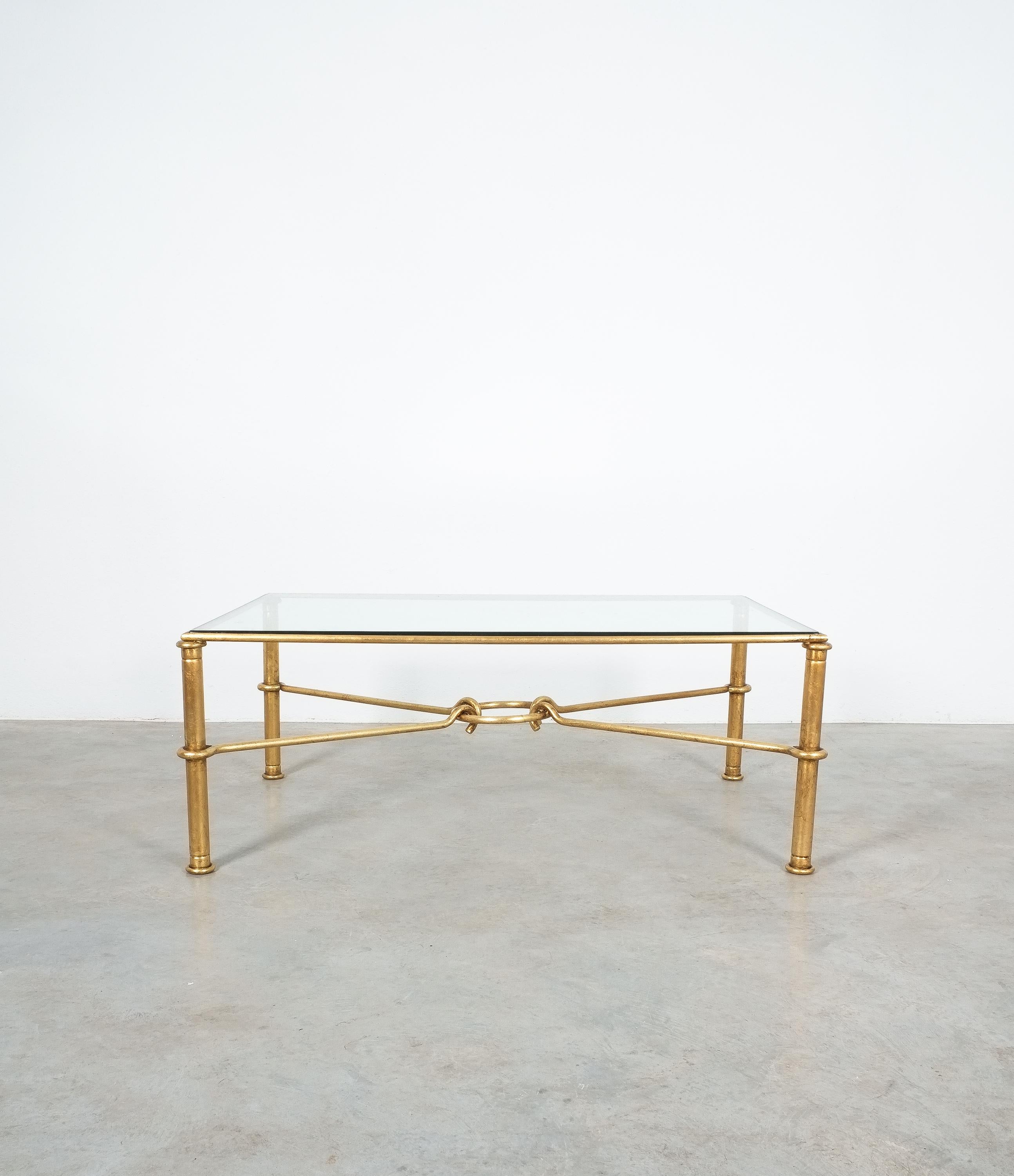 Very large gilt iron coffee table for Hermes by artist/designer Giovanni Banci, Italy, circa 1970

Large center coffee table neoclassical Hermes styling utilizing rings and hooks to simulate a horse bit. The thick high quality glass with