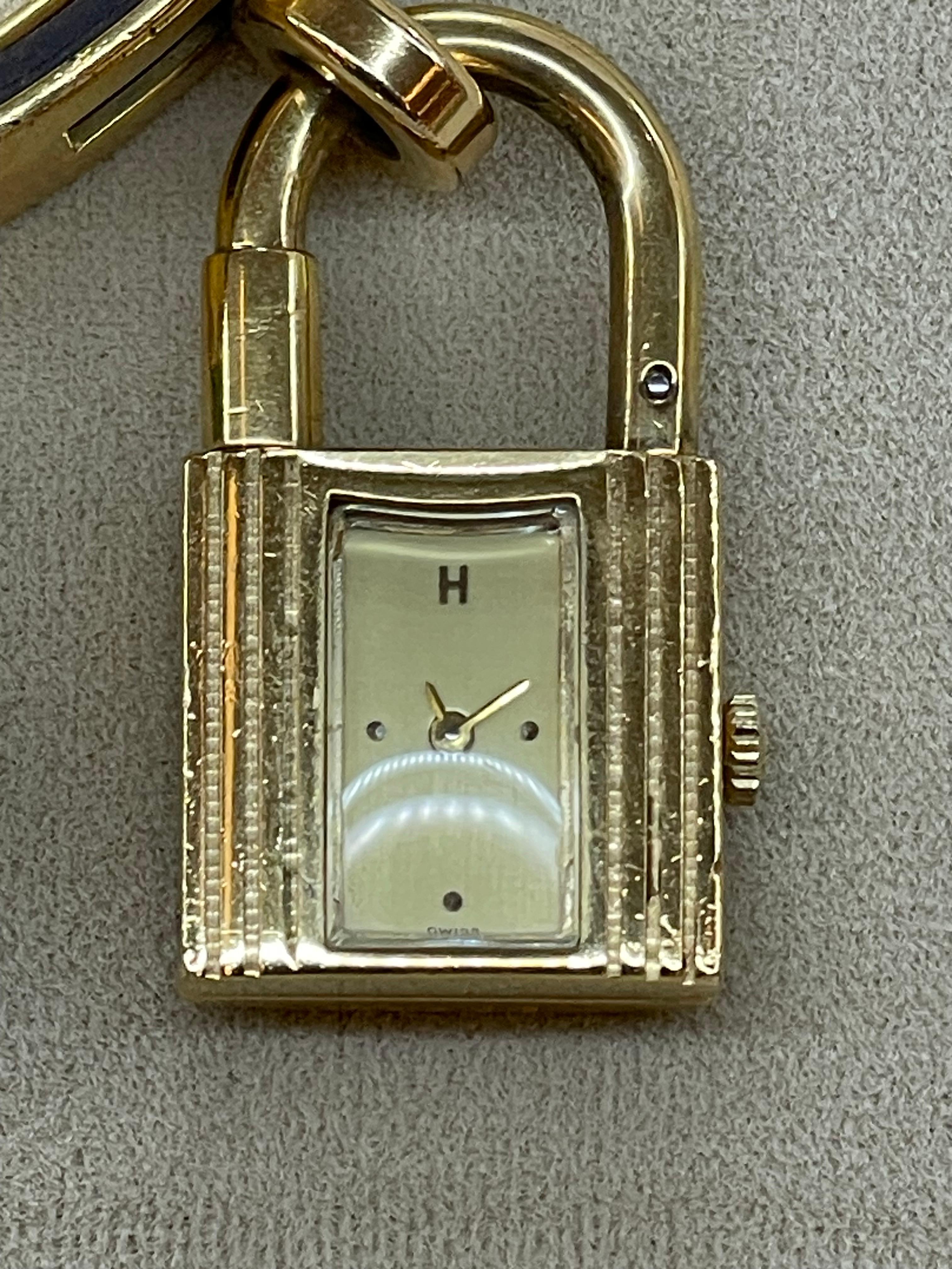Hermès Gilt-Metal 'Kelly' Charm Bracelet-Watch, Signed Hermes In Good Condition For Sale In Manhasset, NY