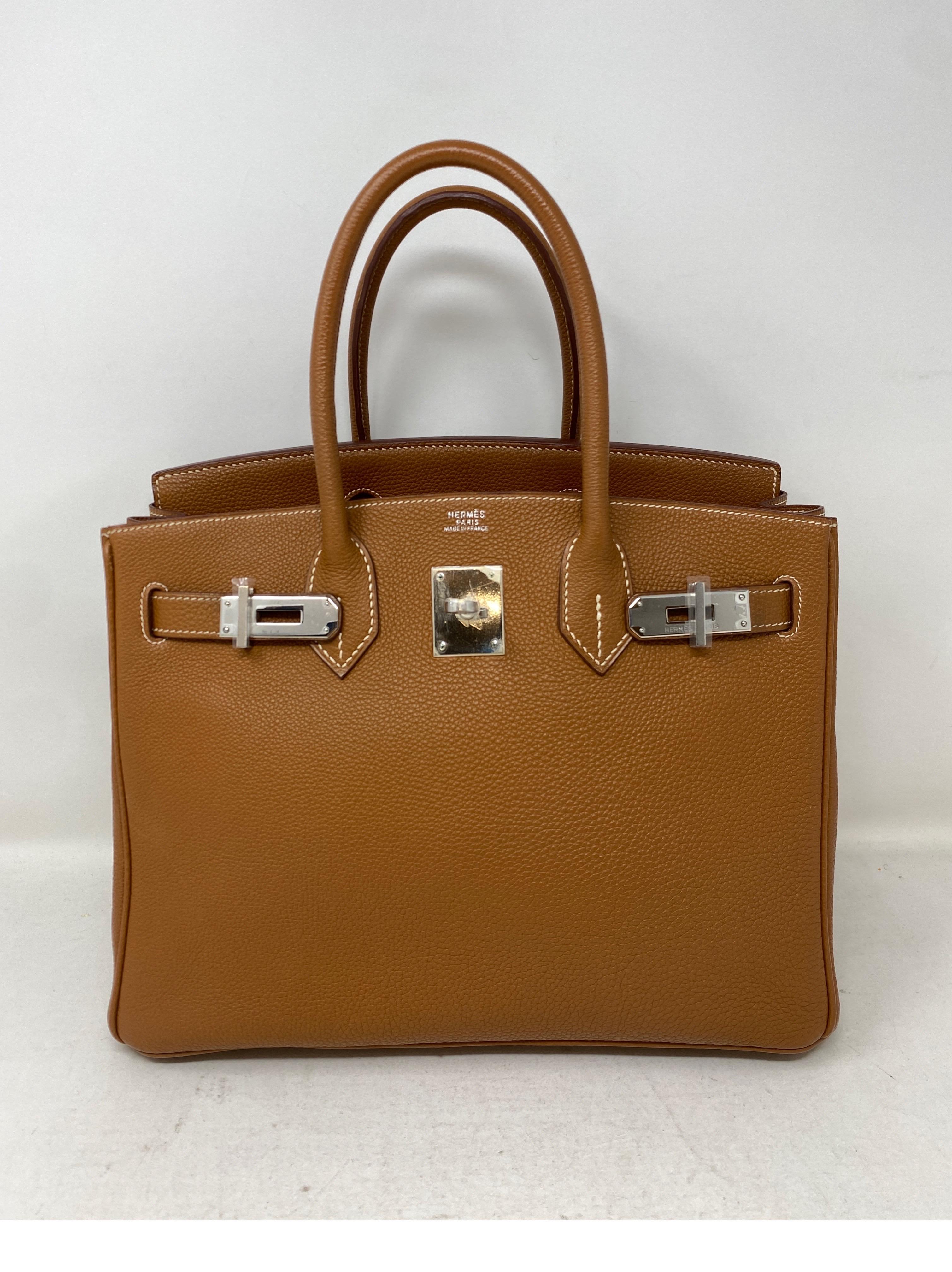 Hermes Gold 30 Birkin with Palladium Silver Hardware Bag. Looks like new. Excellent condition. Plastic is still on the hardware. Gorgeous gold tan color. The classic Hermes color. Size 30 is the most in demand. Great neutral color. Includes