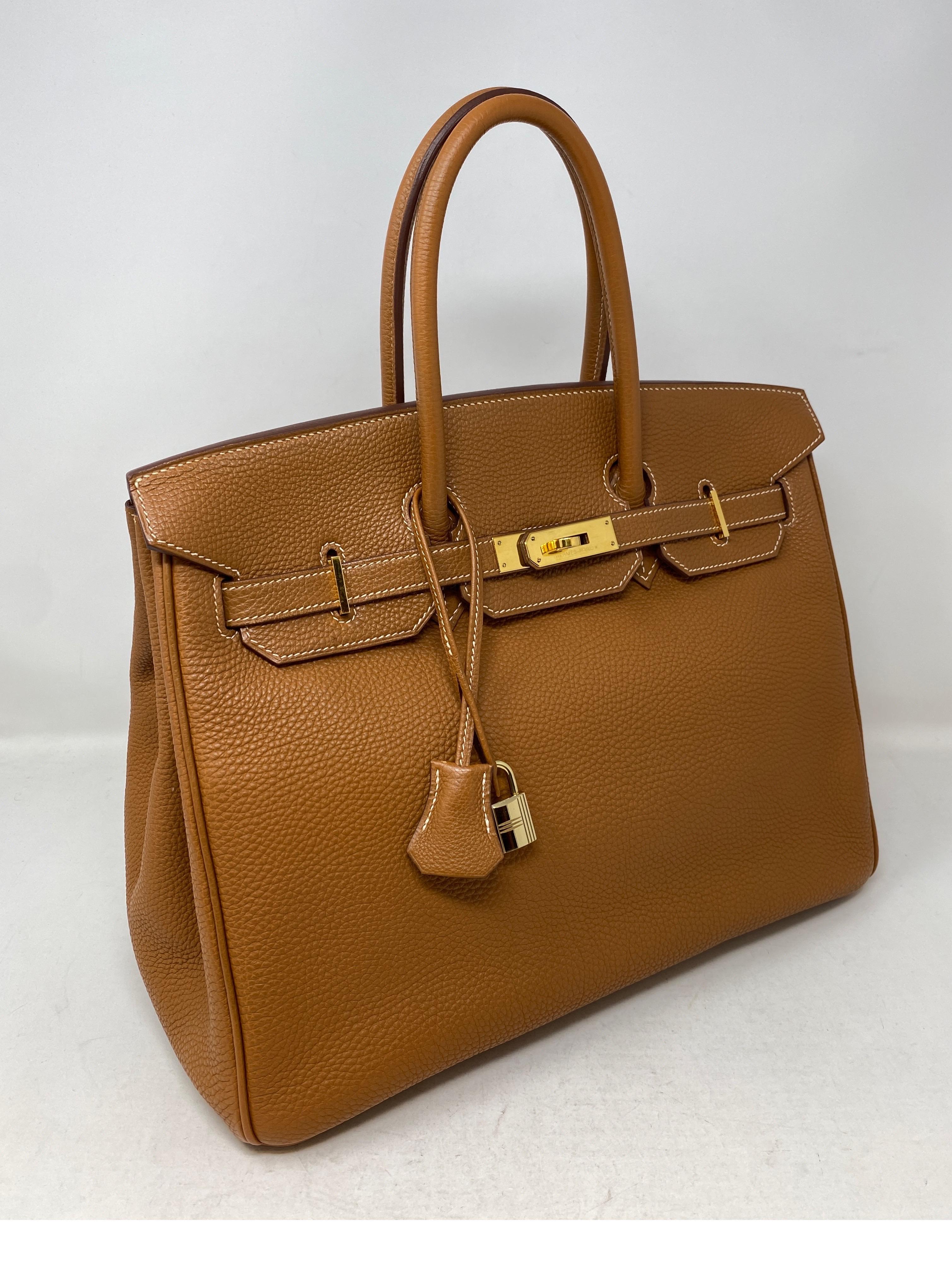 Hermes Gold Birkin 35 Bag. Gold togo leather with gold hardware. Good condition. Hard to find combination. Includes clochette, lock, key, and dust cover. Guaranteed authentic. 