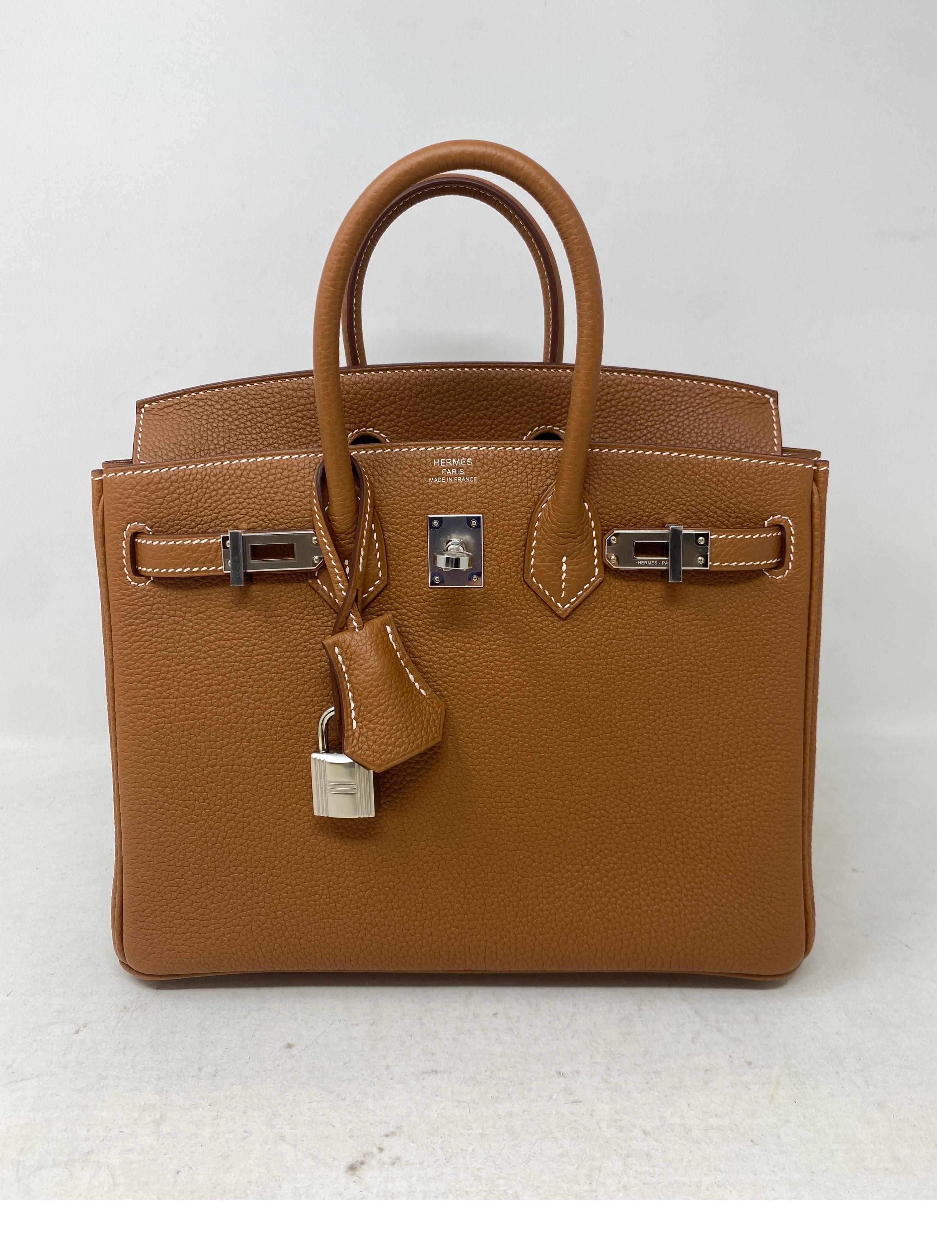 Hermes Gold Birkin 25 Bag. Palladium hardware with gold tan color. Rare unicorn size 25 Birkin. Don't miss out on this one. Very difficult to find and it is brand new. Full set. Includes clochette, lock, keys, rain jacket, dust bag and box. This