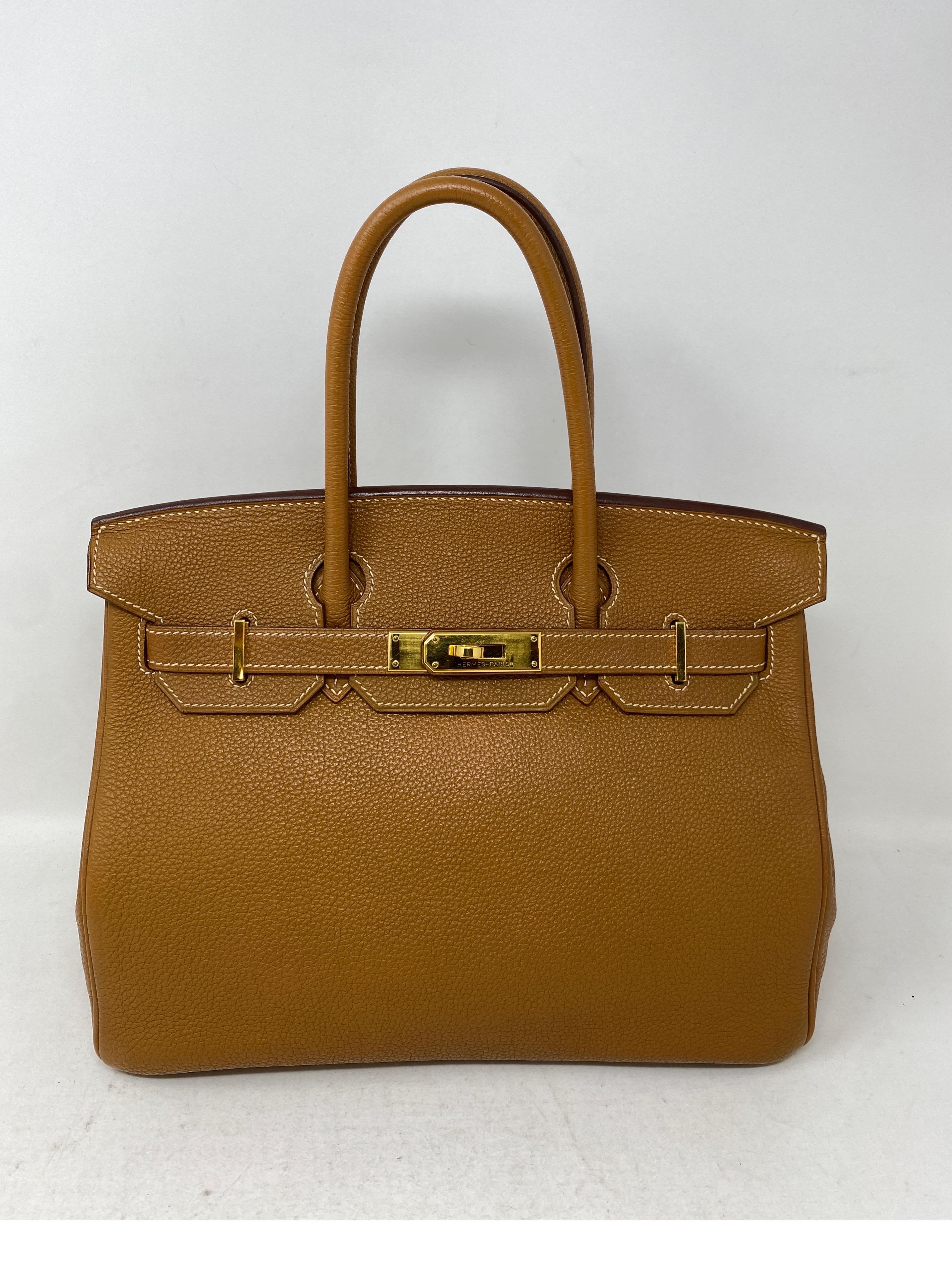 Hermes Gold Birkin 30 Bag. Excellent condition. Most wanted color combination. Gold color leather with gold hardware. Hard to find size 30. Togo leather. Includes clochette, lock, keys, and dust cover. Guaranteed authentic. 
