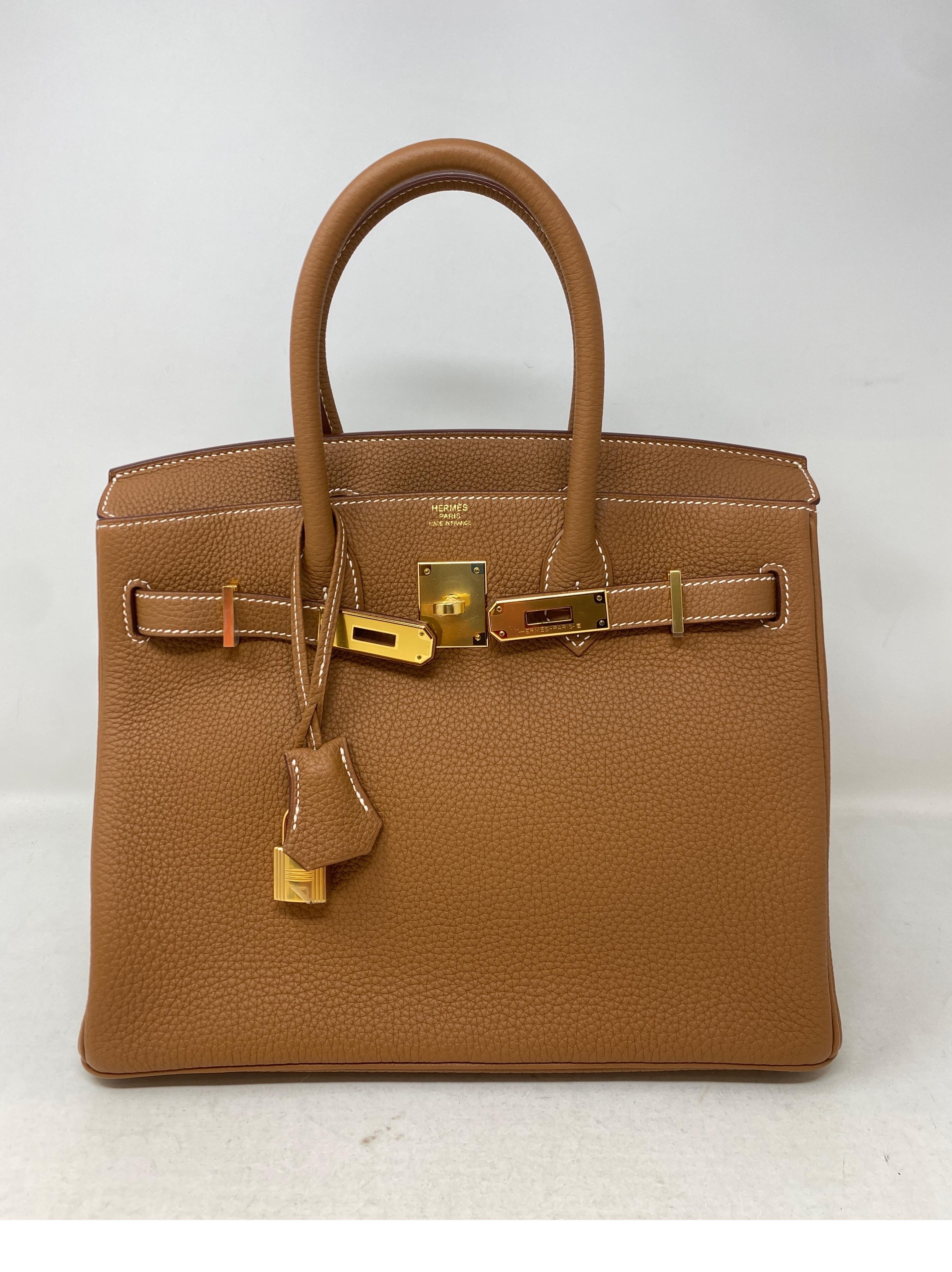 Hermes Gold Birkin 30 Bag. Gold hardware. New Birkin. Togo leather. Never used. Includes full set. Don't miss out on this one. The most wanted size and combination. Very gift worthy. Clochette, lock ,keys, and dust bag. Guaranteed authentic. 