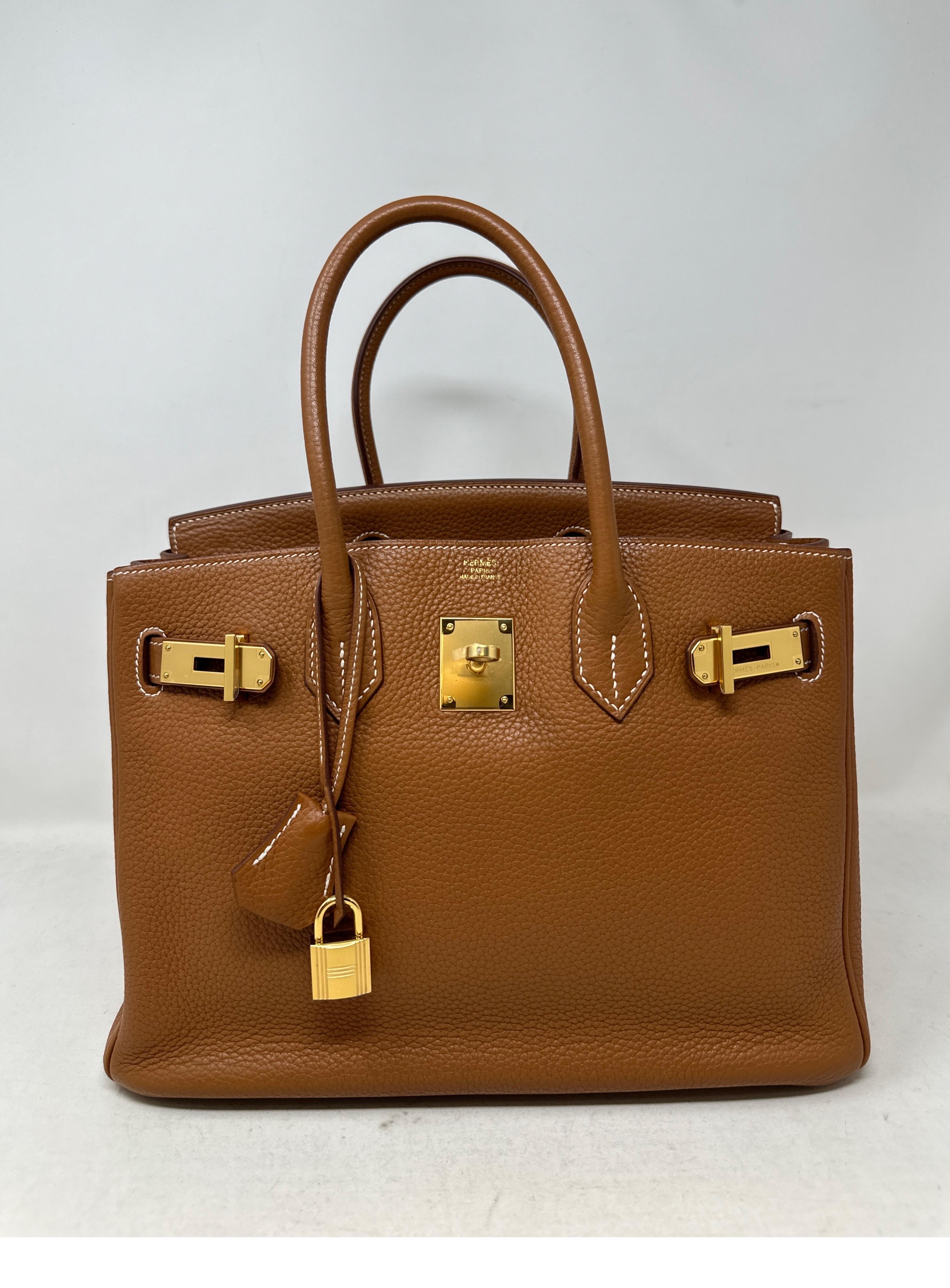 Hermes Gold Birkin 30 Bag. Gold togo leather with gold hardware. Good condition. Has one light spot behind one handle. Interior is clean. Includes clochette, lock, keys, and dust bag. Guaranteed authentic. 