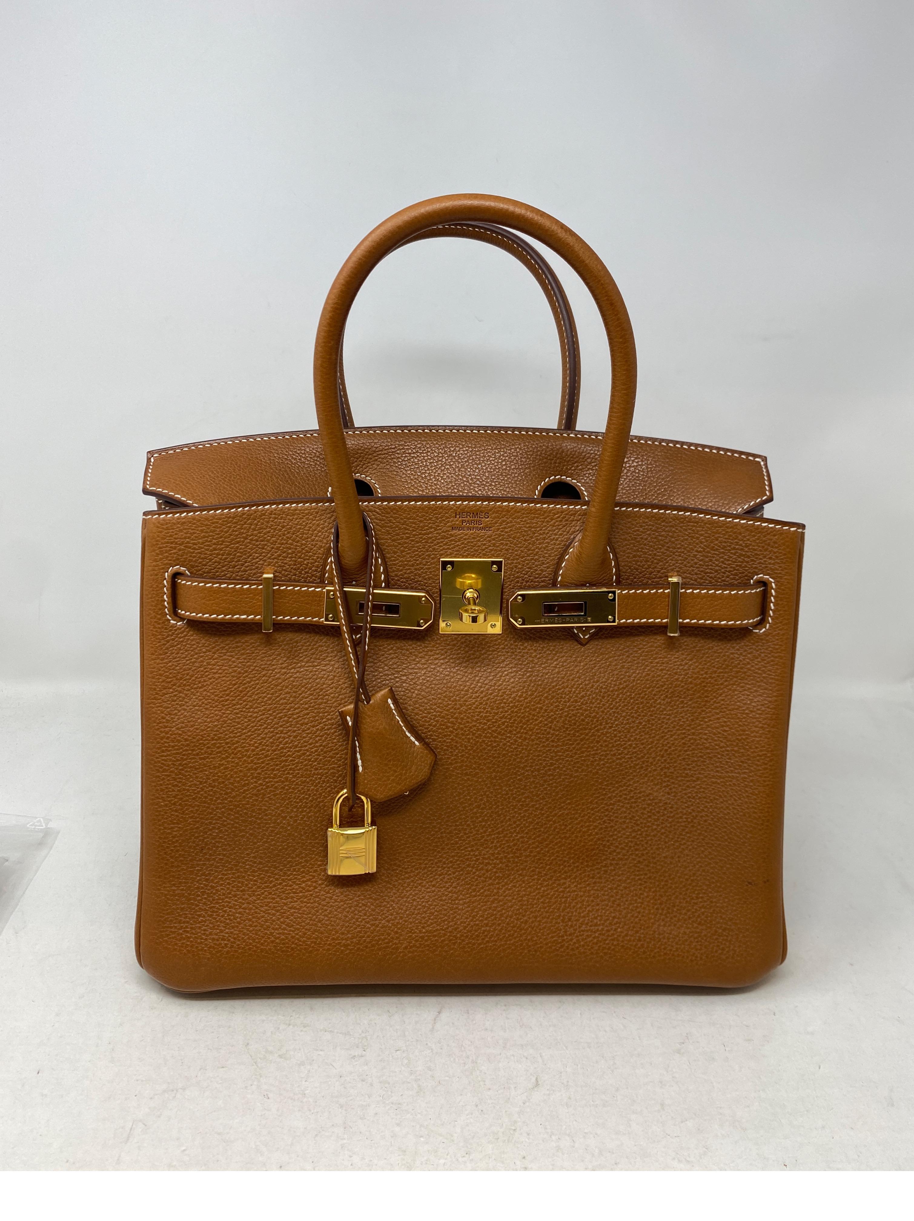 Hermes Gold Barenia Fauborg Birkin 30 Bag. Beautiful rare leather by Hermes. Has a gorgeous patina over time. This one has a few small spots of wear. Not noiticeable. Please see all photos. The bag is like new from 2019. Gold color leather and gold