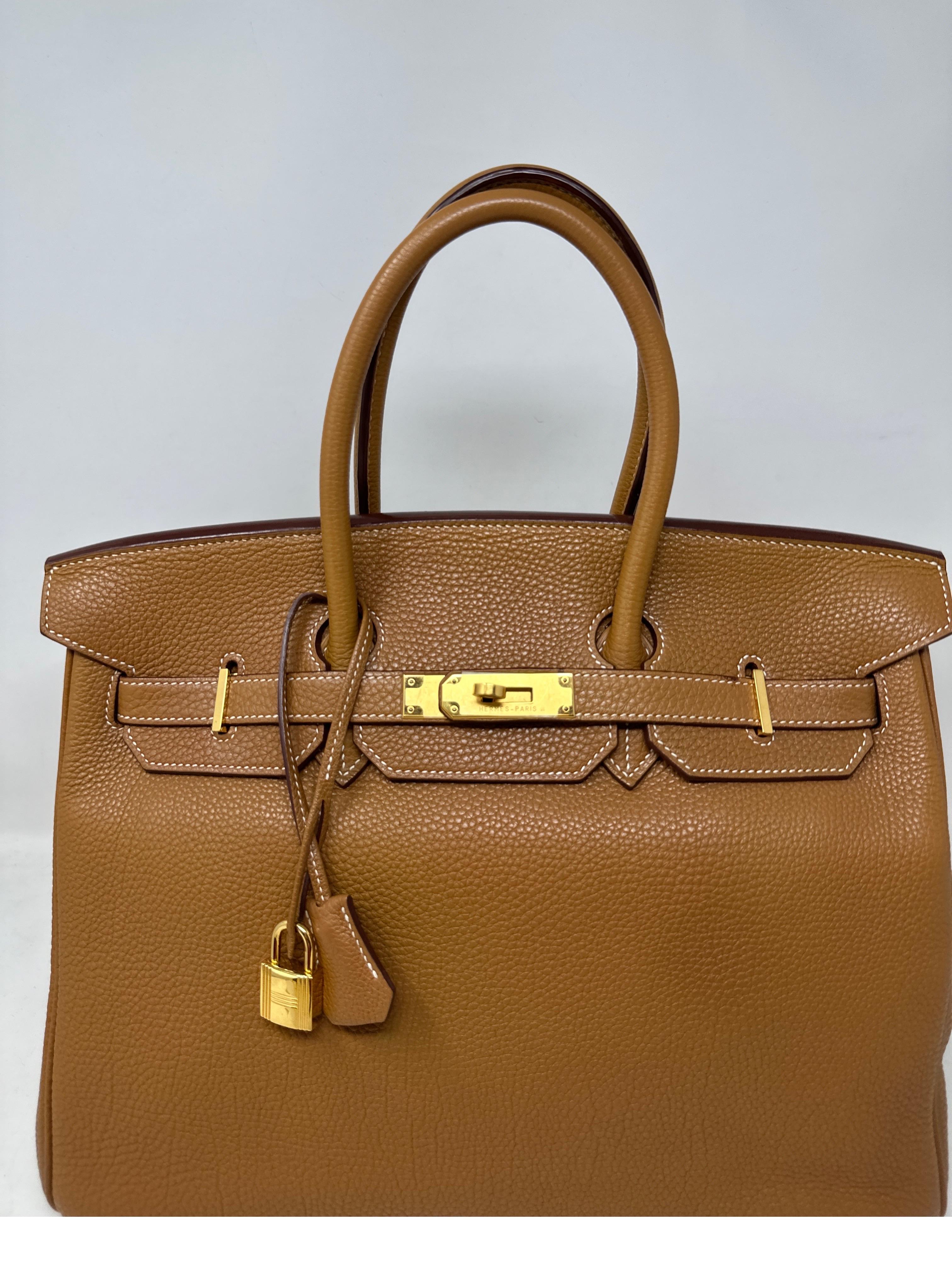 Hermes Gold Birkin 35 Bag. Excellent condition. Gold tan color with gold hardware. Togo leather. Interior clean. The most wanted combination. Own the classic. Great investment bag. Includes clochette, lock, keys, and dust bag. Guaranteed authentic. 