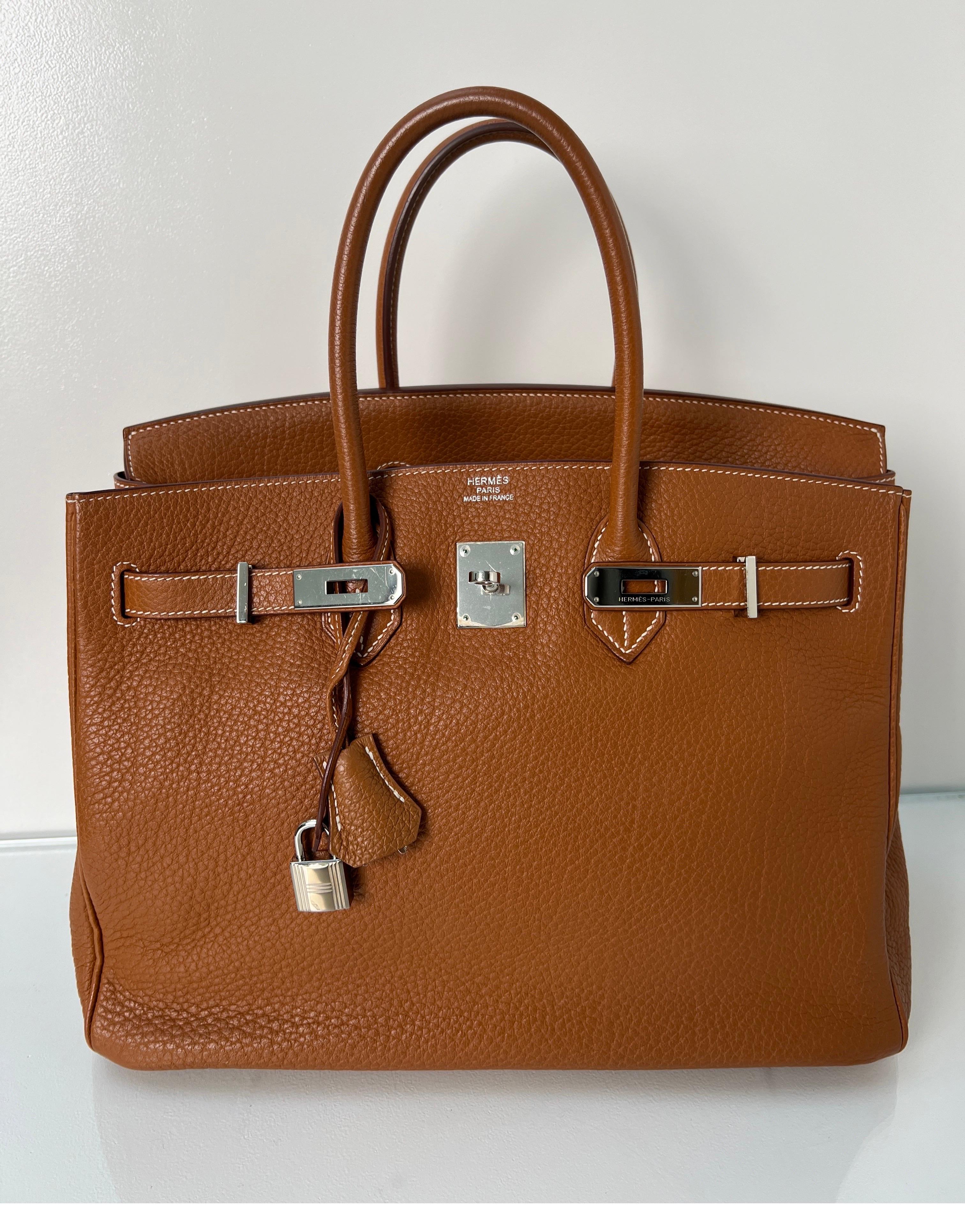 Hermes Gold Birkin 35 Bag. Gold tan color bag with silver palladium hardware. Very good condition. Interior clean. Plastic is still on the hardware. Togo leather is very sturdy. Priced to sell. Don't let this one get away. Classic Birkin