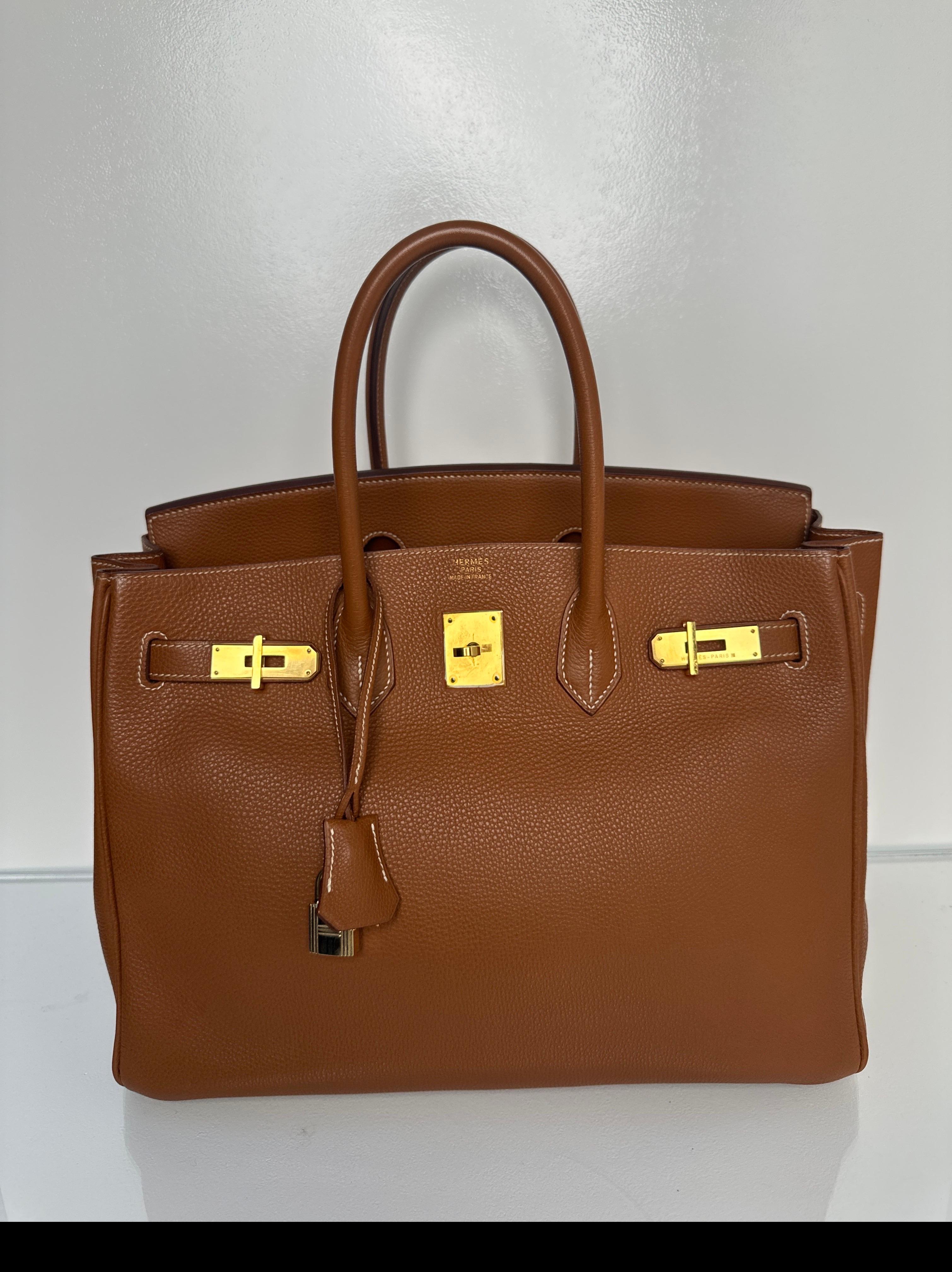 Hermes Gold Birkin 35 Bag. Very good condition. Gold hardware. The most wanted combination. Classic investment bag. Interior clean. Includes clochette, lock, keys, and dust bag. Guaranteed authentic. Don't miss out on this one. 