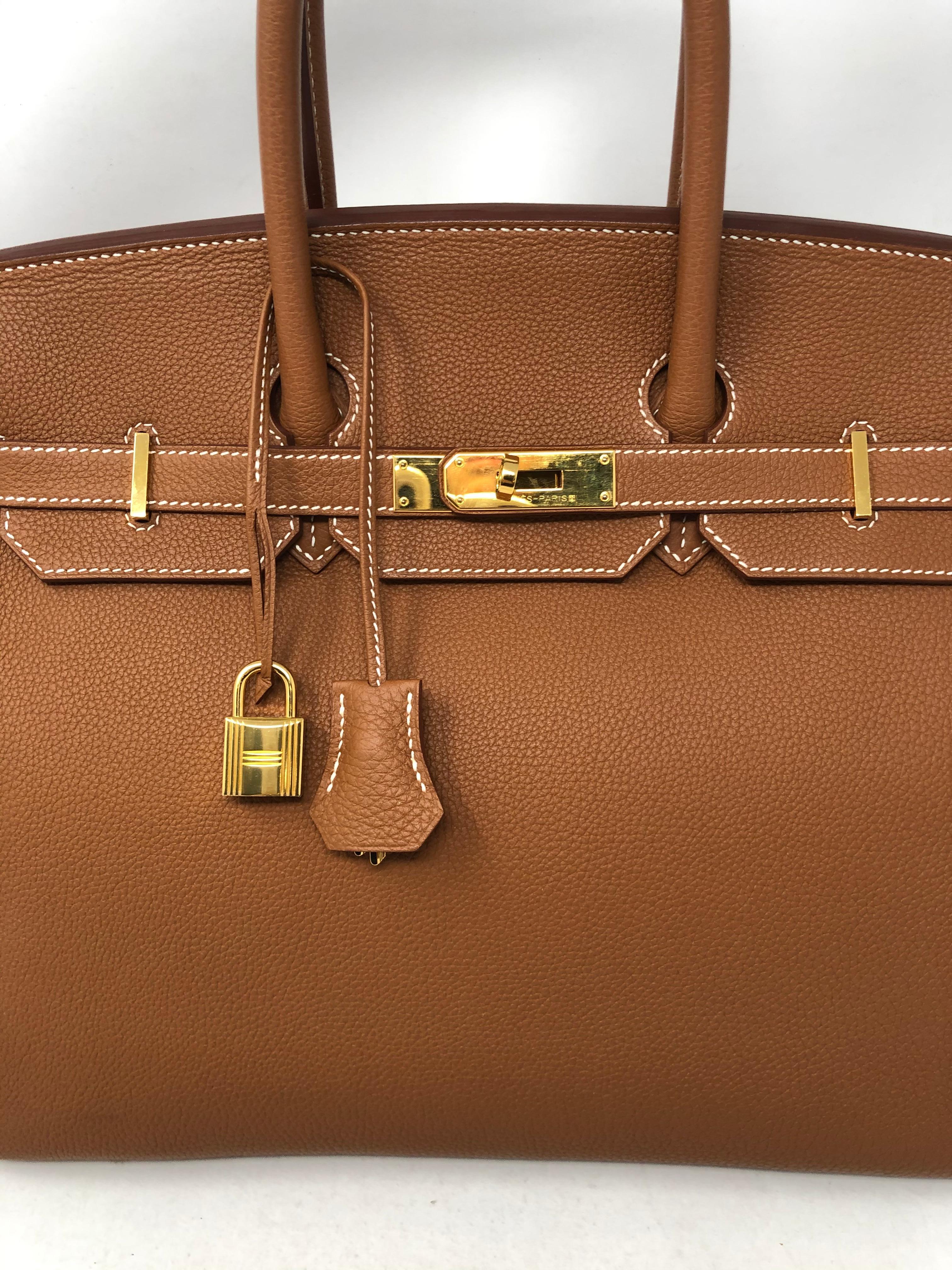 Hermes Gold Birkin 35 in Togo Leather. Gold color with gold hardware. The most wanted combination. Purchased 2016-2017. Looks brand new. Kept in Hermes box. Beautiful togo leather and stored correctly. Includes clochette, lock and keys. Hermes Dust