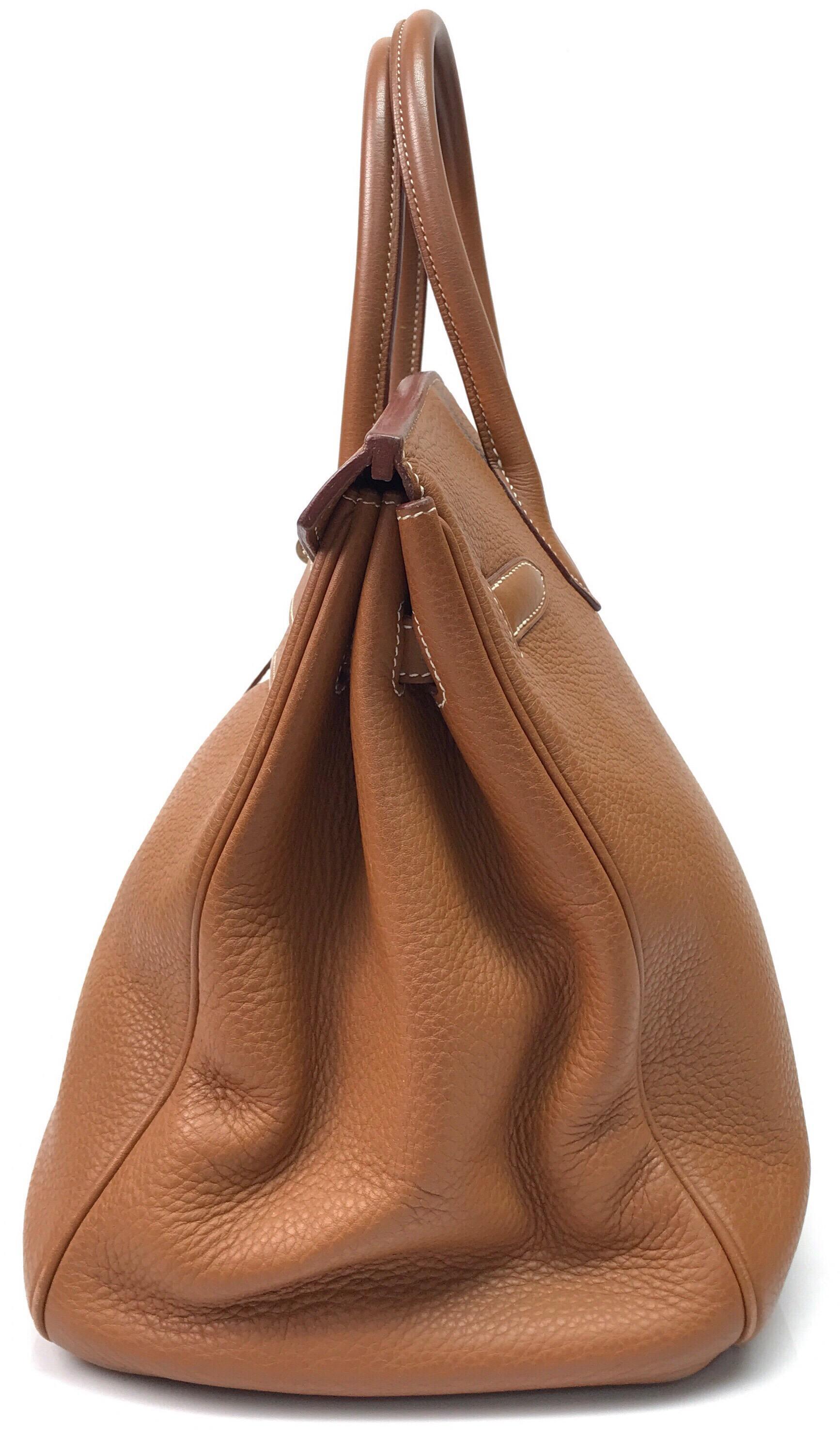 Hermes Gold Birkin PHW 35cm. This beautiful Hermes Birkin is in excellent condition, there is no sign of use. It is made of gold Togo leather throughout and has silver hardware. It is the traditional birkin style bag and is very spacious. It has the