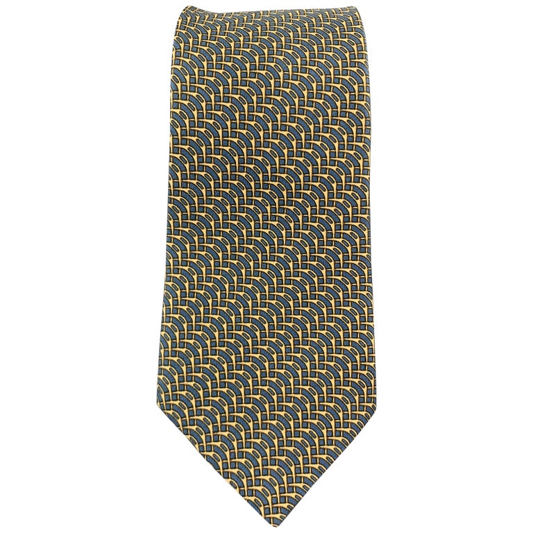 HERMES Gold and Blue Abstract Interlock Print Silk Tie For Sale at 1stdibs