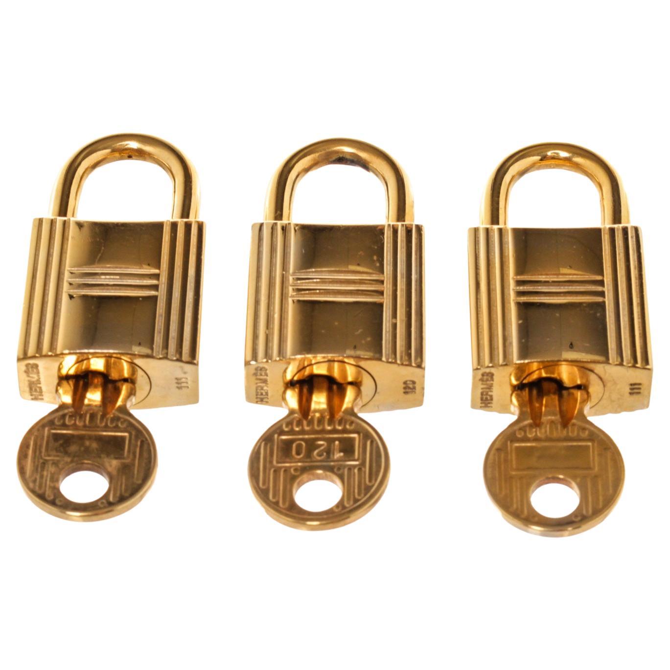 Hermes Gold Cadena Lock Schlüsselanhänger-Set mit Gold-Hartware und gedrehtem Schlossverschluss