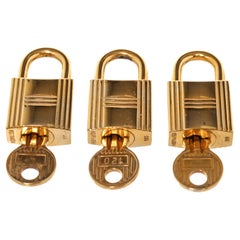Hermes Gold Cadena Lock Schlüsselanhänger-Set mit Gold-Hartware und gedrehtem Schlossverschluss