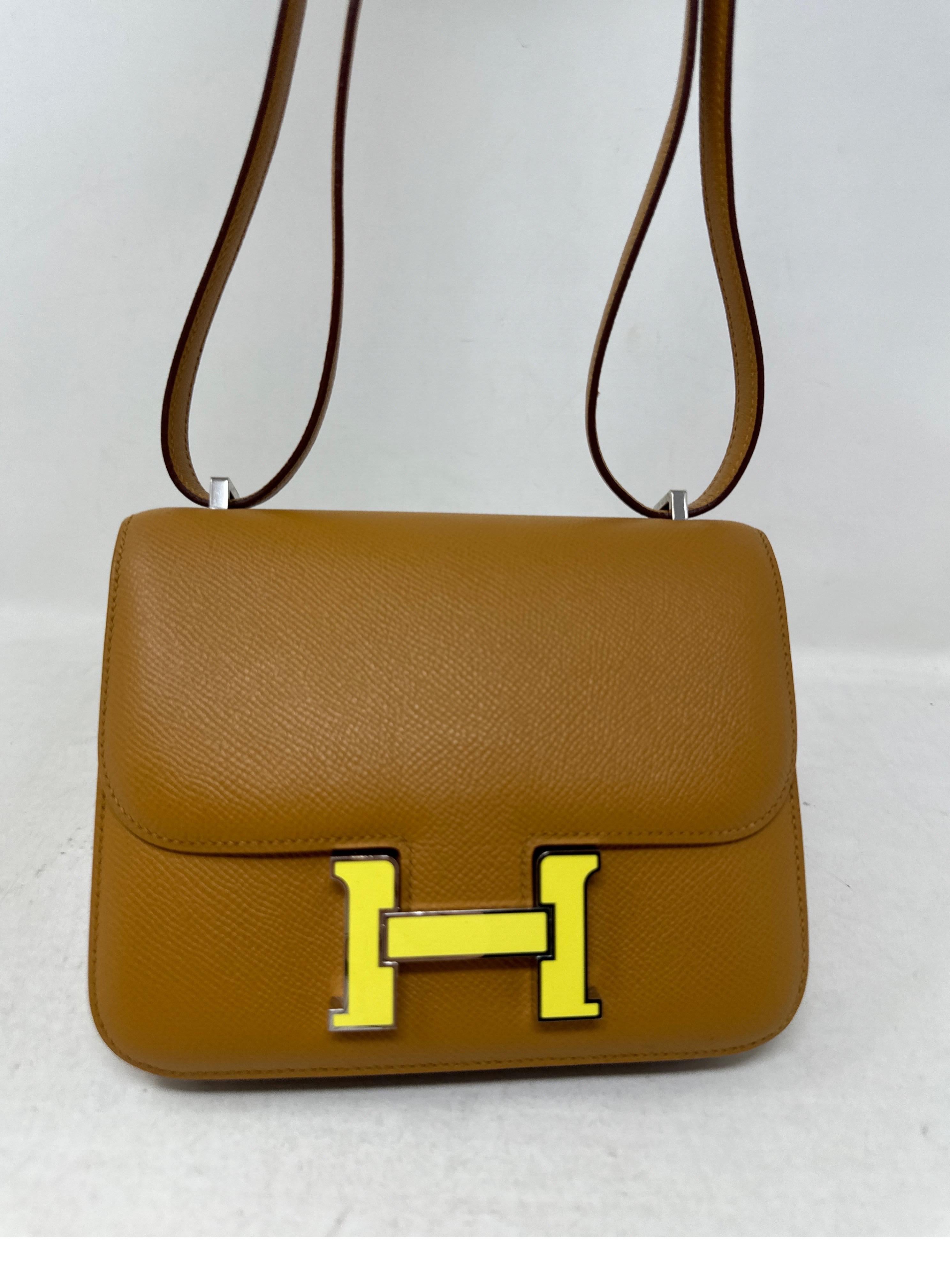 Hermes Gold Constance 18 Bag. Gold tan color epsom leather bag. Can be worn crossbody or doubled as a shoulder bag. Yellow enamel hardware H clasp. Excellent like condition. Interior clean. Includes dust bag and box. Guaranteed authentic. 