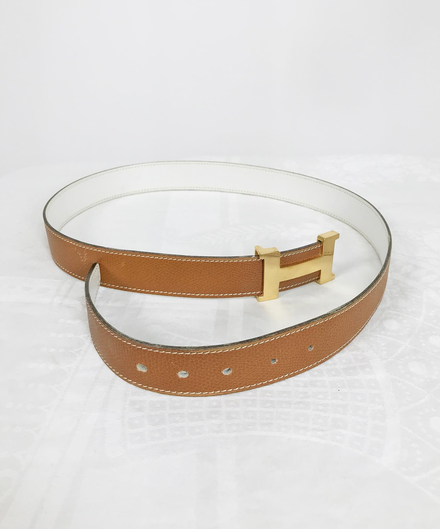 Hermes gold Constance H buckle and tan/cream belt, vintage from the 1970s in very good condition. Pre owned, the belt and buckle have been well cared for. Two extra holes have been added to the belt, a total of 3 original + 2. The gold plated buckle