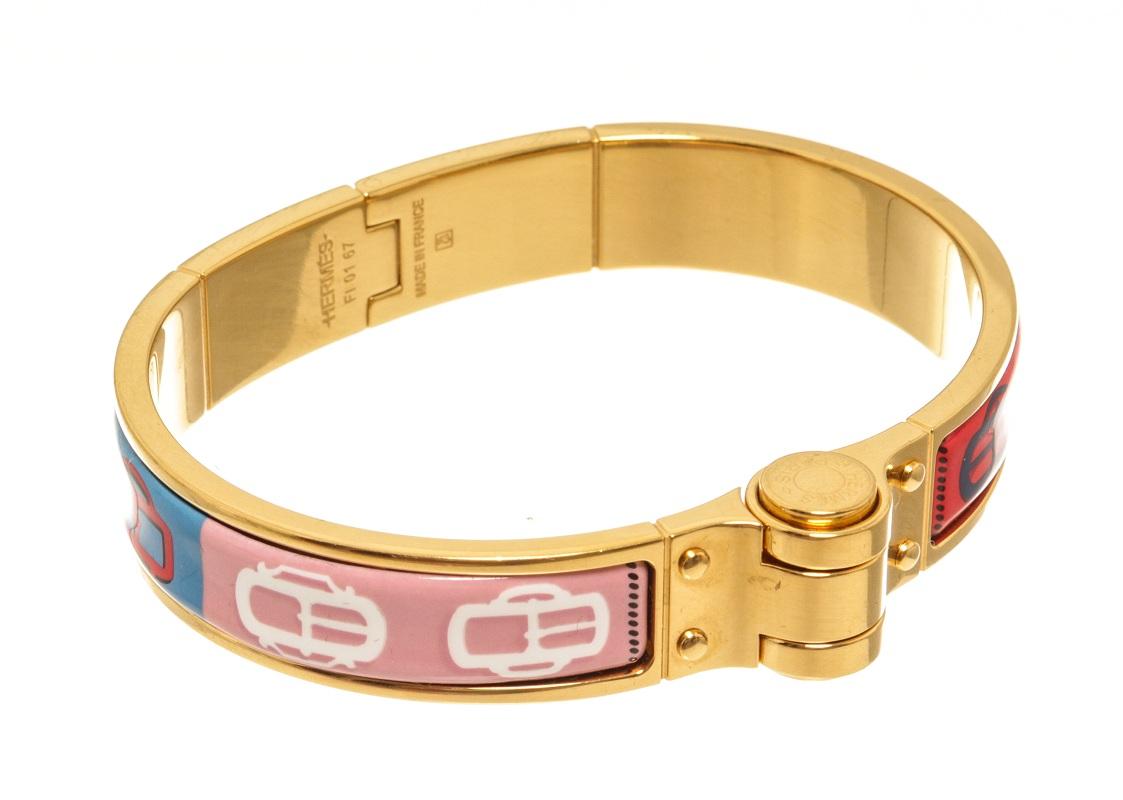 Hermes gold hardware Charniere bangle with multicolor pattern, hinge, and a click closure.


84994MSC