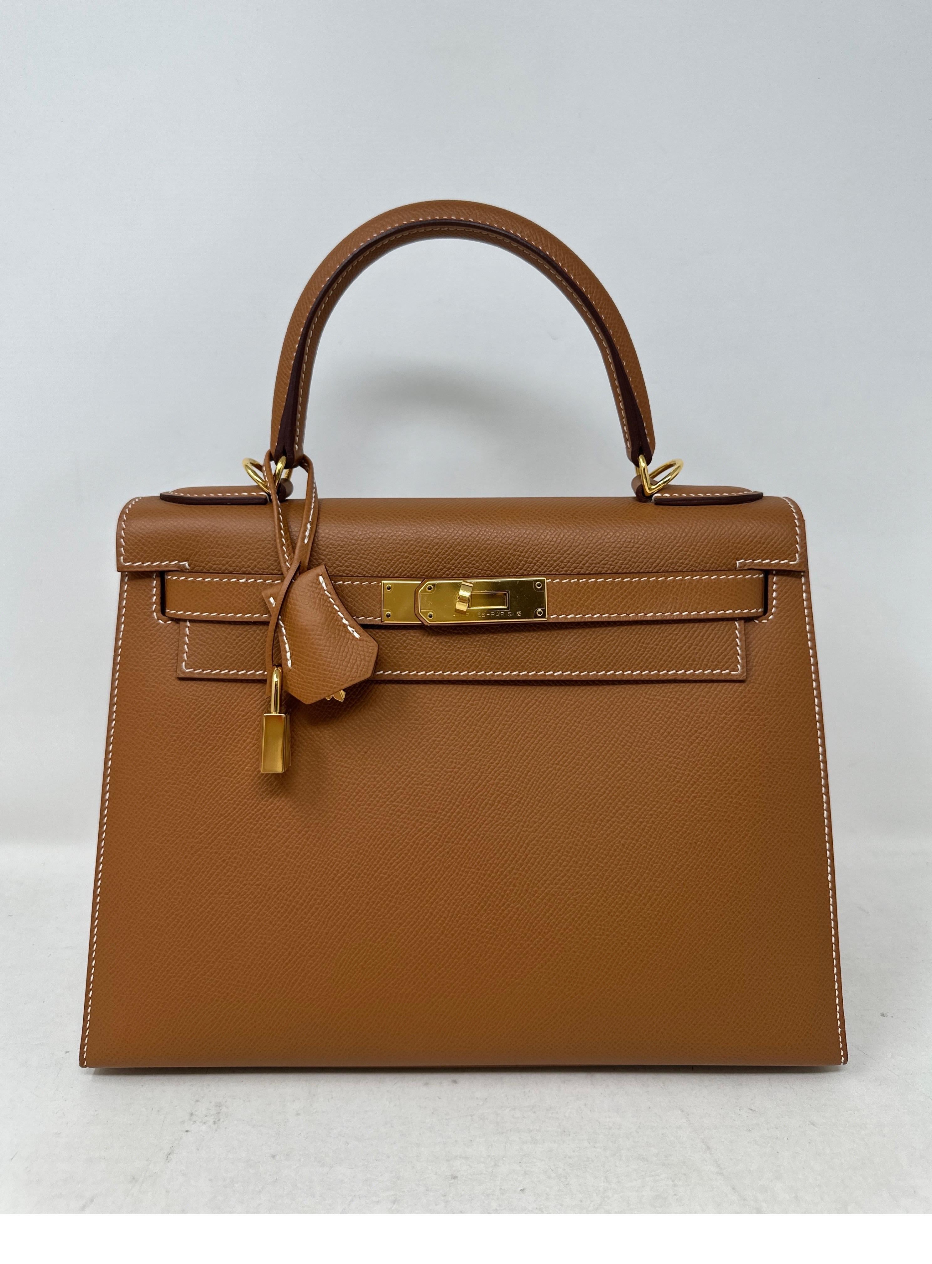 Hermes Gold Kelly 28 Bag. Beautiful epsom sellier Kelly bag. Most wanted combination gold tan color with gold hardware. Looks like new condition. Plastic is still on the hardware. Strap was never used. Structure in very nice and interior clean.