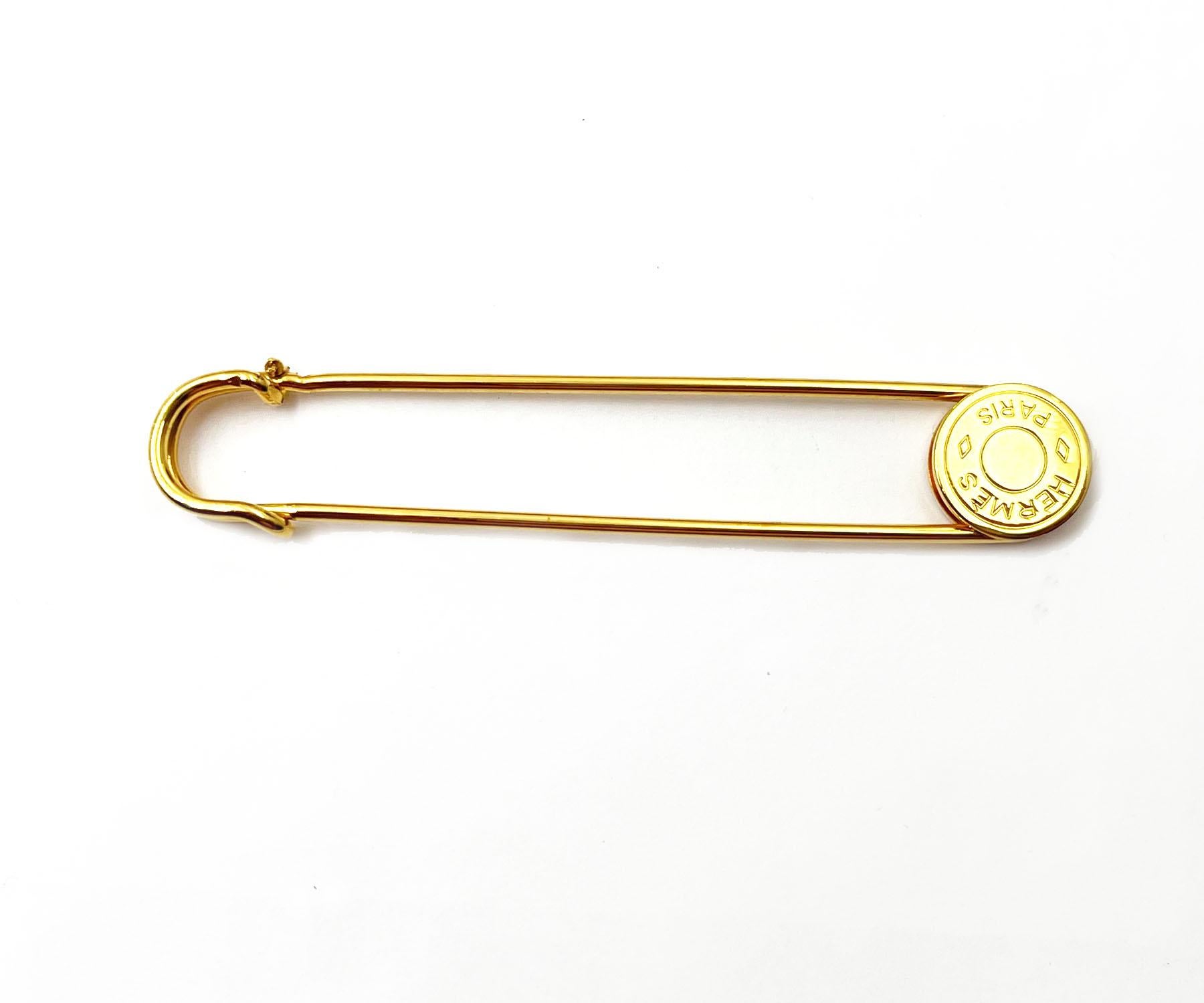 Hermes Gold Plated Clou De Selle Safety Pin 

*Marked Hermes
*Made in France
*Comes with the original box 

-It is approximately 0.5″ x 3